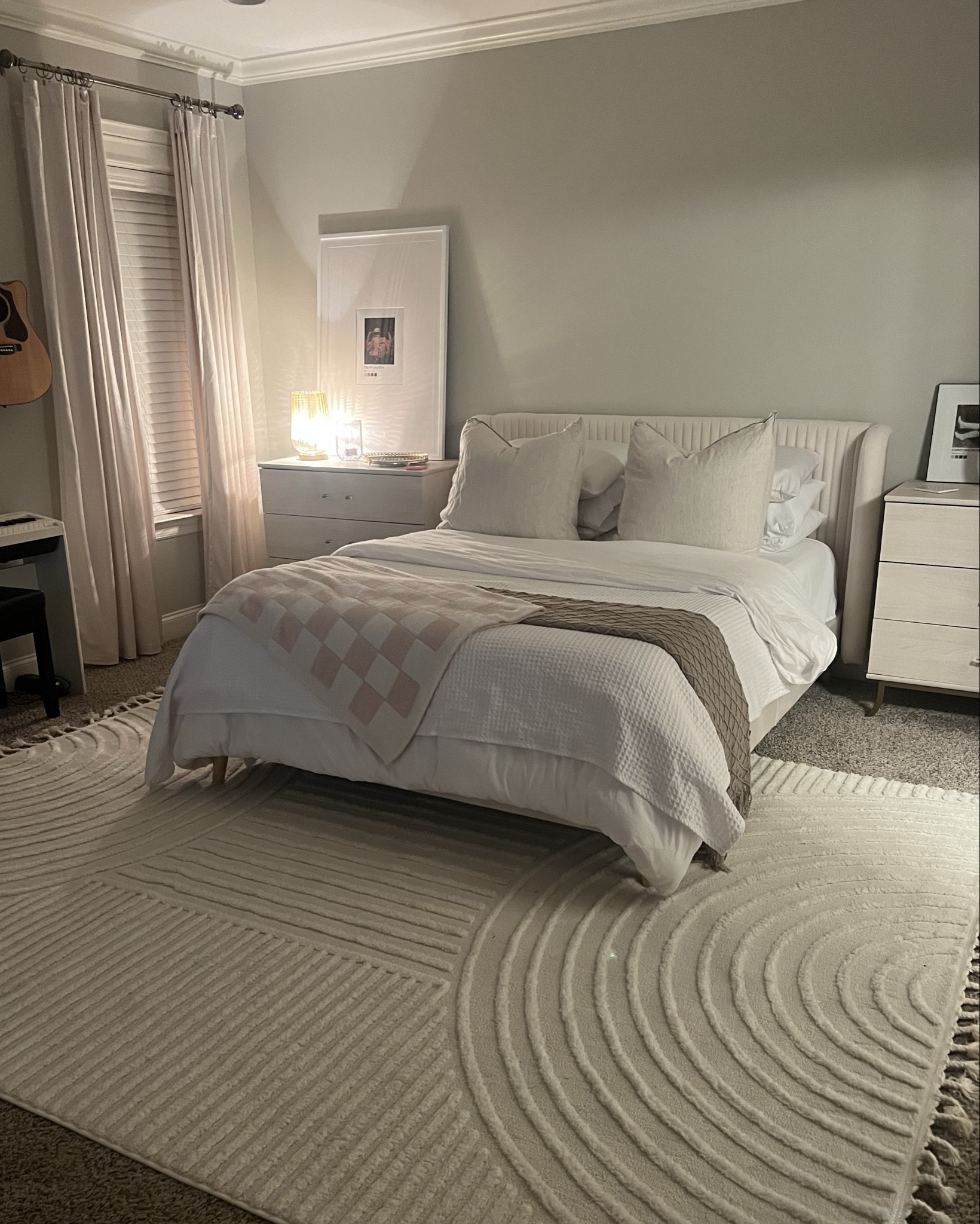 My space is always a work in progress, but my goal was to create a bedroom that actually feels like rest. Soft neutrals, cozy textures, and pieces that don’t break the bank. I’ve linked everything below that makes my room feel calm, clean, but still lived in.

Pro tip: kids’ dressers make the best affordable luxury nightstands.
And yes — even with dogs, I still think white duvets are the best option.

One of my favorite things about keeping a very neutral room is the ability to change out sheets for holidays or different seasons. I love adding a pop of color, fun florals, or something festive when the mood hits.

#LTKHome