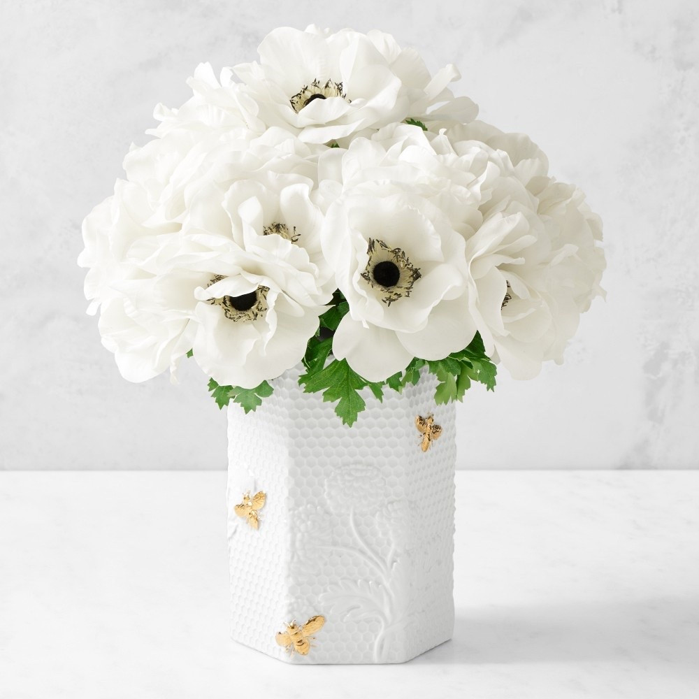 Honeycomb Porcelain Hexagon Vase

Abuzz with charming spring style, our exclusive vase is the perfect choice for displaying fresh-cut blooms. It's crafted of durable bisque-fired porcelain, embossed with lush flowers and honeycombs, and adorned with gold-tone bees. A great gift, the hexagonal vessel works well in any room of the house.

#LTKHome #LTKdayinmylife #LTKSeasonal