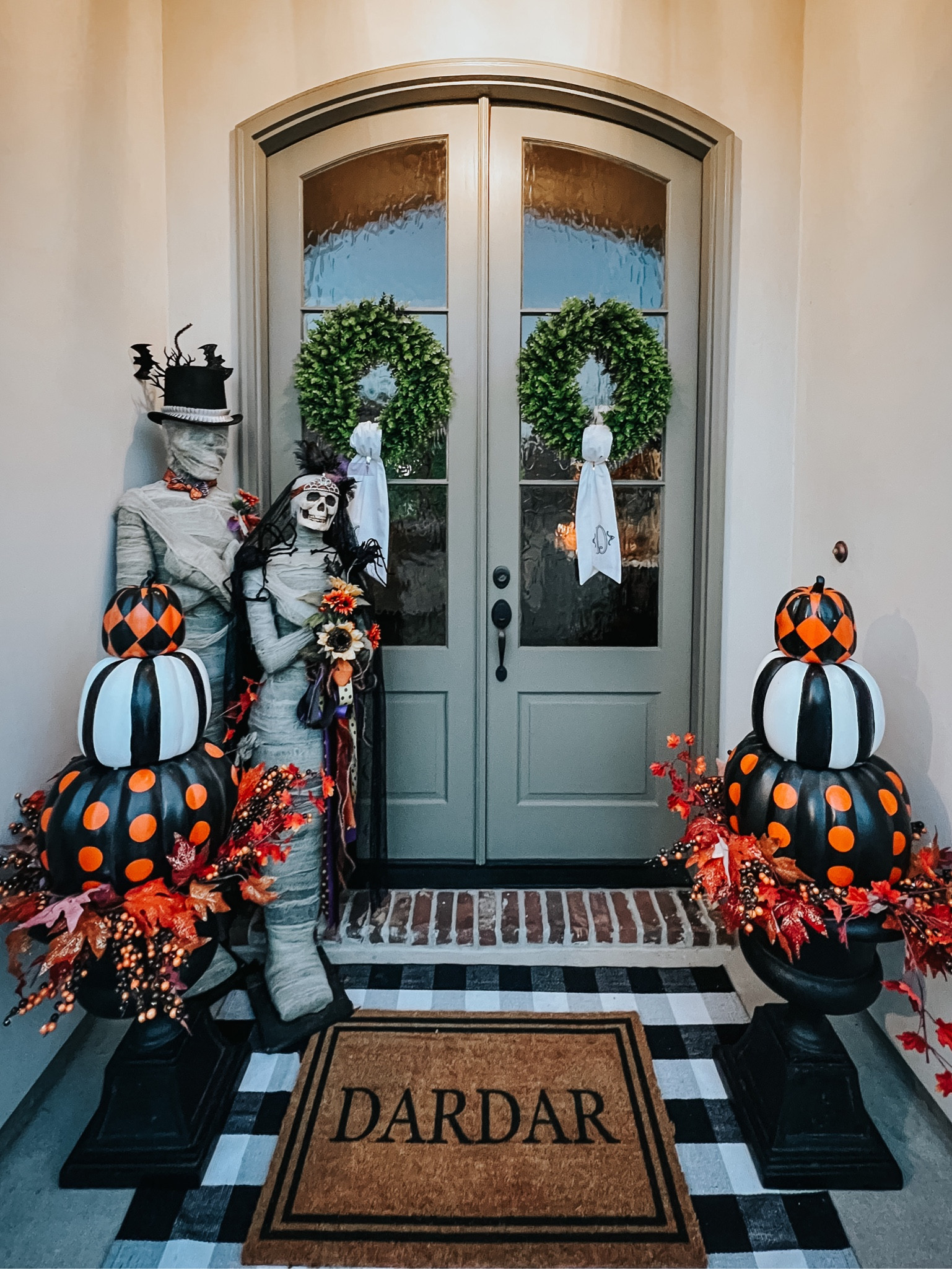Front door fall/Halloween decor is always my favorite to throw together & I love love love how this came out! The orange floral/branch arrangement under the pumpkin topiaries is thrown together with pieces from hobby lobby. #pumpkins #frontdoorfall 

#LTKSeasonal #LTKHalloween #LTKHoliday