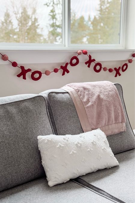 We added a little festive Valentine’s Day flair to our #LTKplayroom today! ❌⭕️🩷♥️ this garland is perfect for hanging along the windowsill — I just attach it with a bit of Scotch tape! The blanket and pillow cover are older, but are still available!

#LTKSeasonal #LTKkids