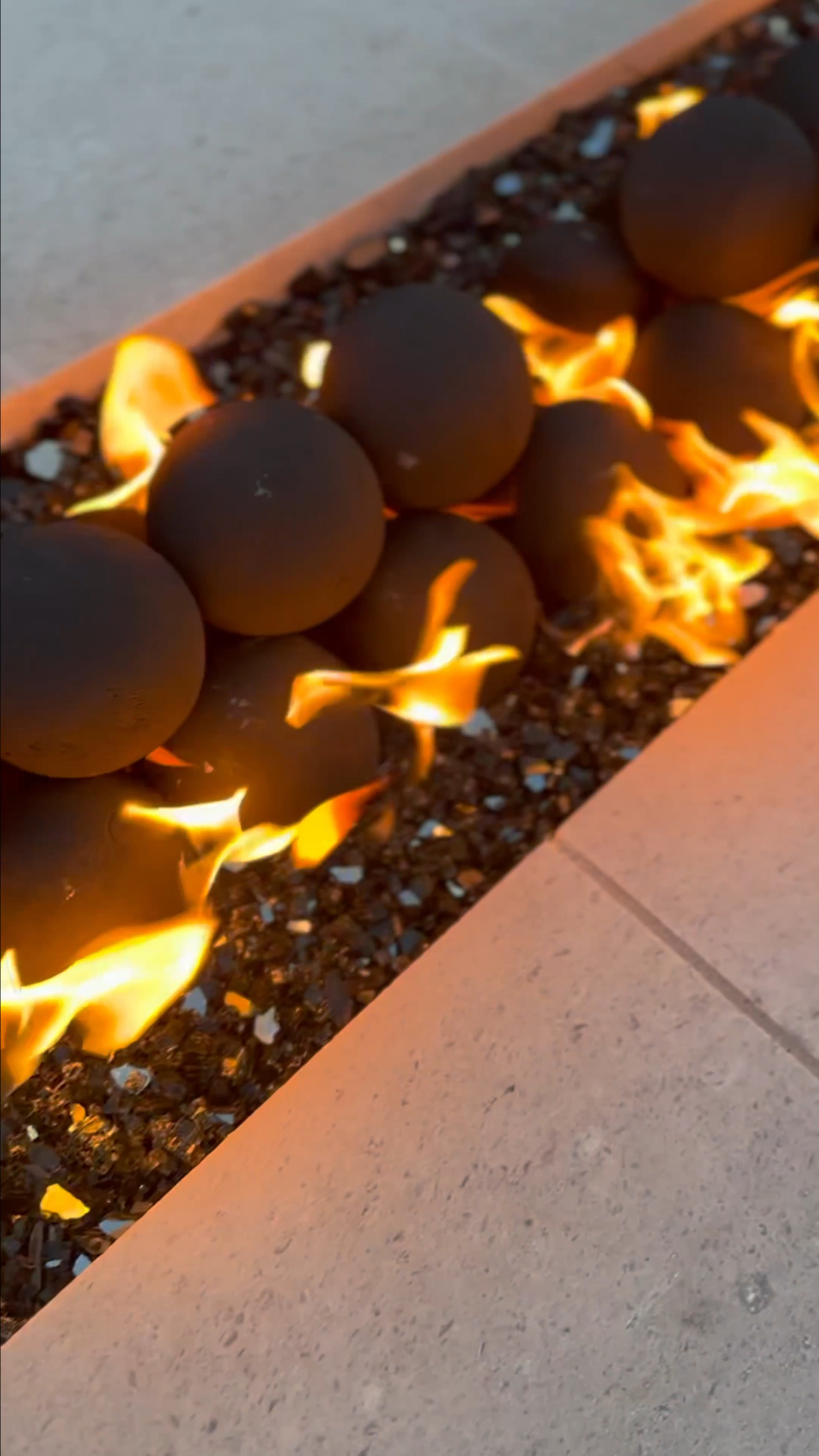 Firepit almost complete. On the hunt for a different glass barrier but I really do love the way these fire spheres and glass make the fire so pretty to look at 🖤

#LTKVideo #LTKhome #LTKfindsunder100