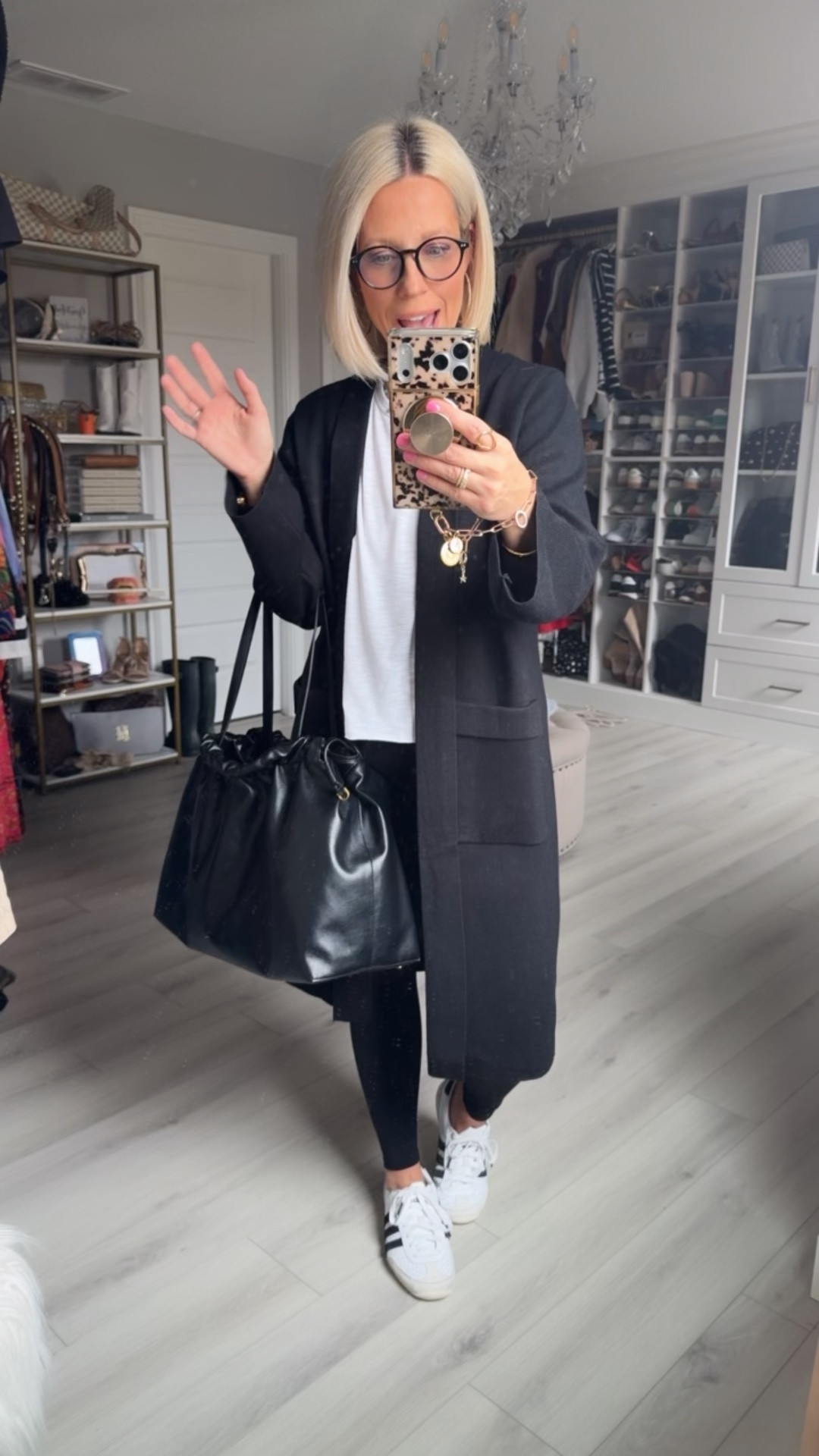 Headed to the state wrestling tournament!!! Here’s my comfy travel outfit for the day!!! I’m even more obsessed with this bag now that I took the packaging filler out!!!! Perfect for traveling!!!
⬇️⬇️⬇️
Cardigan medium 
Tee medium 
Leggings small
Shoes TTS

#LTKTravel #LTKSaleAlert #LTKmomlife