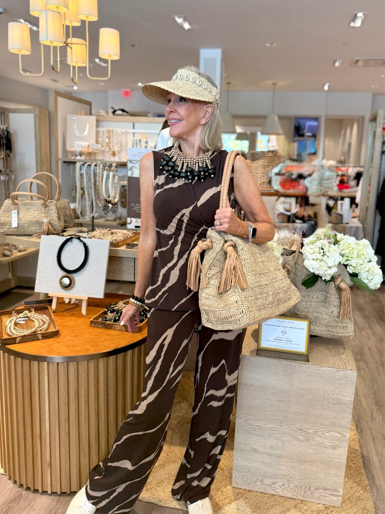 Romi The Brand X Chico’s accessories handmade in Bali. Trunk show with the designer. So many awesome pieces to choose from. 
My brown zebra faux wrap top and wide leg pants are so cute and comfy. Great for now and on into early fall. Perfect with Romi accessories

#LTKOver40 #LTKTravel #LTKootd
