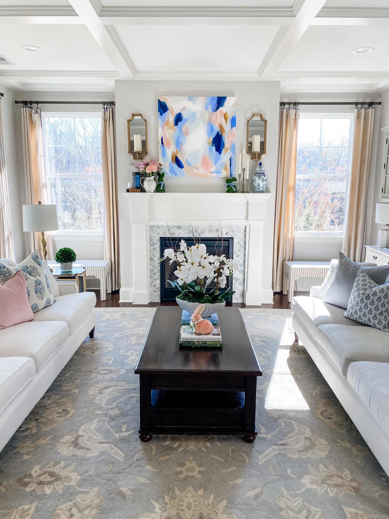 Spring living room home decor! Decorative bunnies, orchid, coffee table books, throw pillows, sconces, etc!

#LTKhome #LTKSeasonal #LTKFind