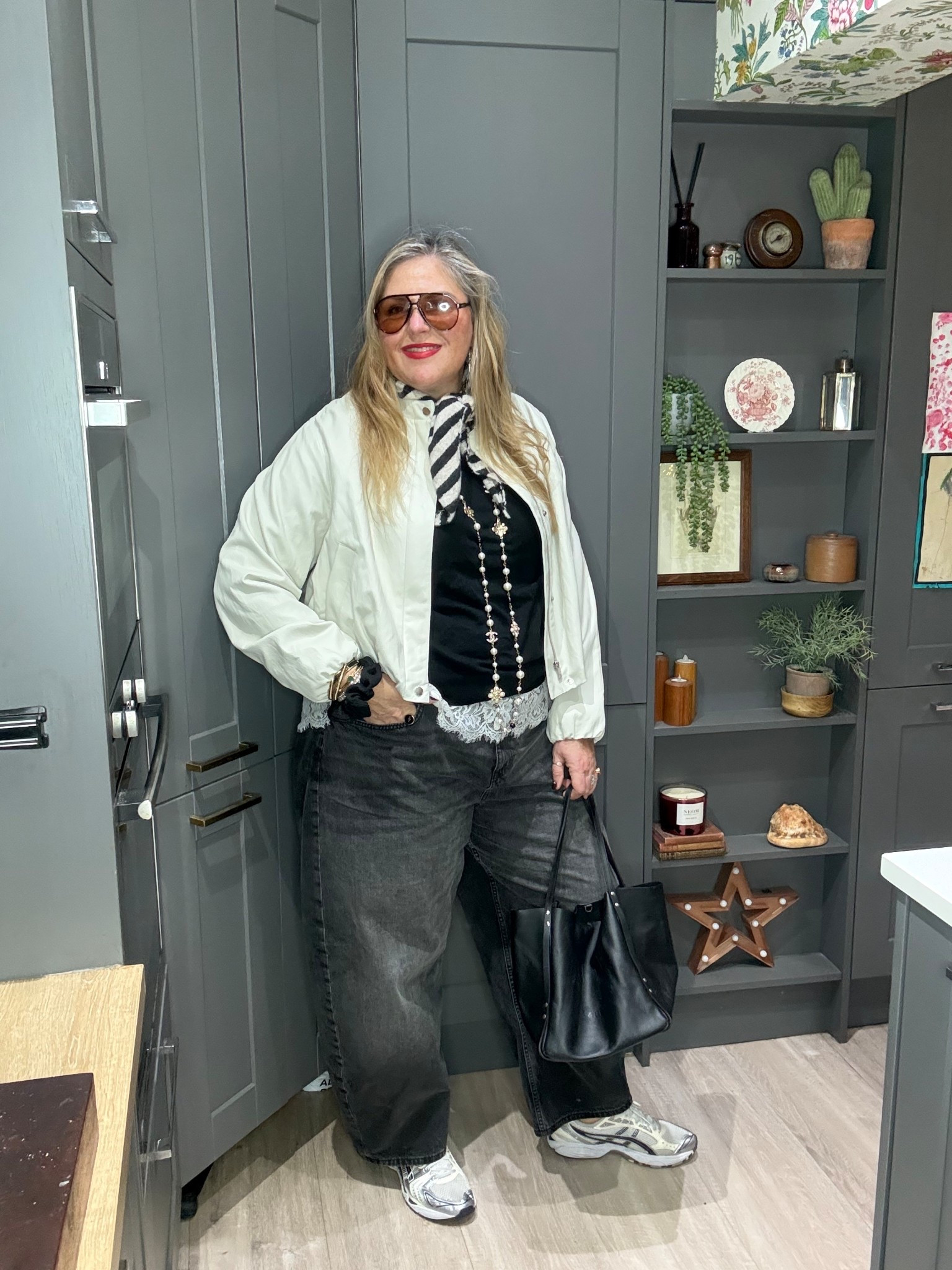 Ecru faux leather jacket, black jumper, white lace tshirt, black barrel jeans, trainers , black bag, striped neck scarf, necklace, sunglasses 

#LTKplussize #LTKjeans #LTKspring