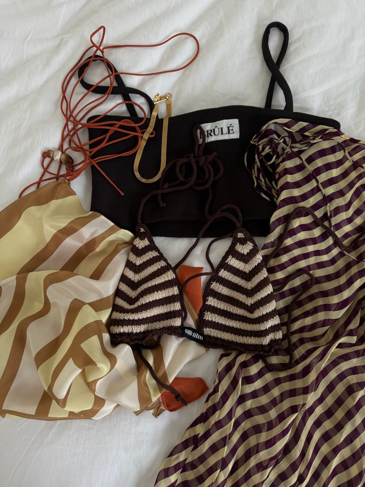 Vacation outfit planning ⛱️ Featuring a crochet bikini top, silk printed items, a cropped bandeau tank, and dainty gold jewelry: perfect for your next beach getaway or tropical escape.

#LTKSwim #LTKStyleTip #LTKTravel