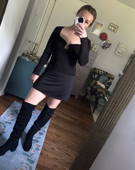 Black on black on black outfit with mini skirt, long sleeve top, and over the knee boots 

#LTKSeasonal