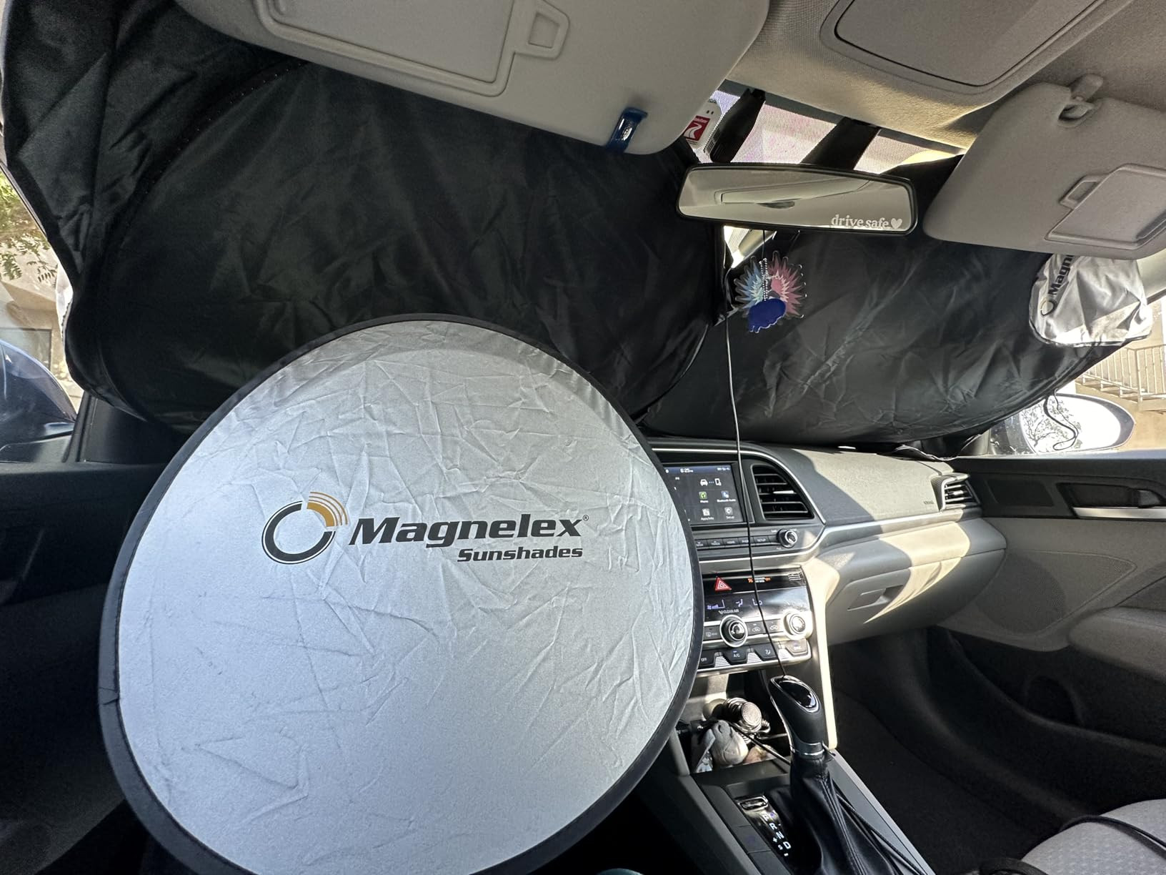 Magnelex Car Windshield Sunshade with Bonus Steering Wheel Sun Shade. Reflective Polyester Blocks... | Amazon (US)