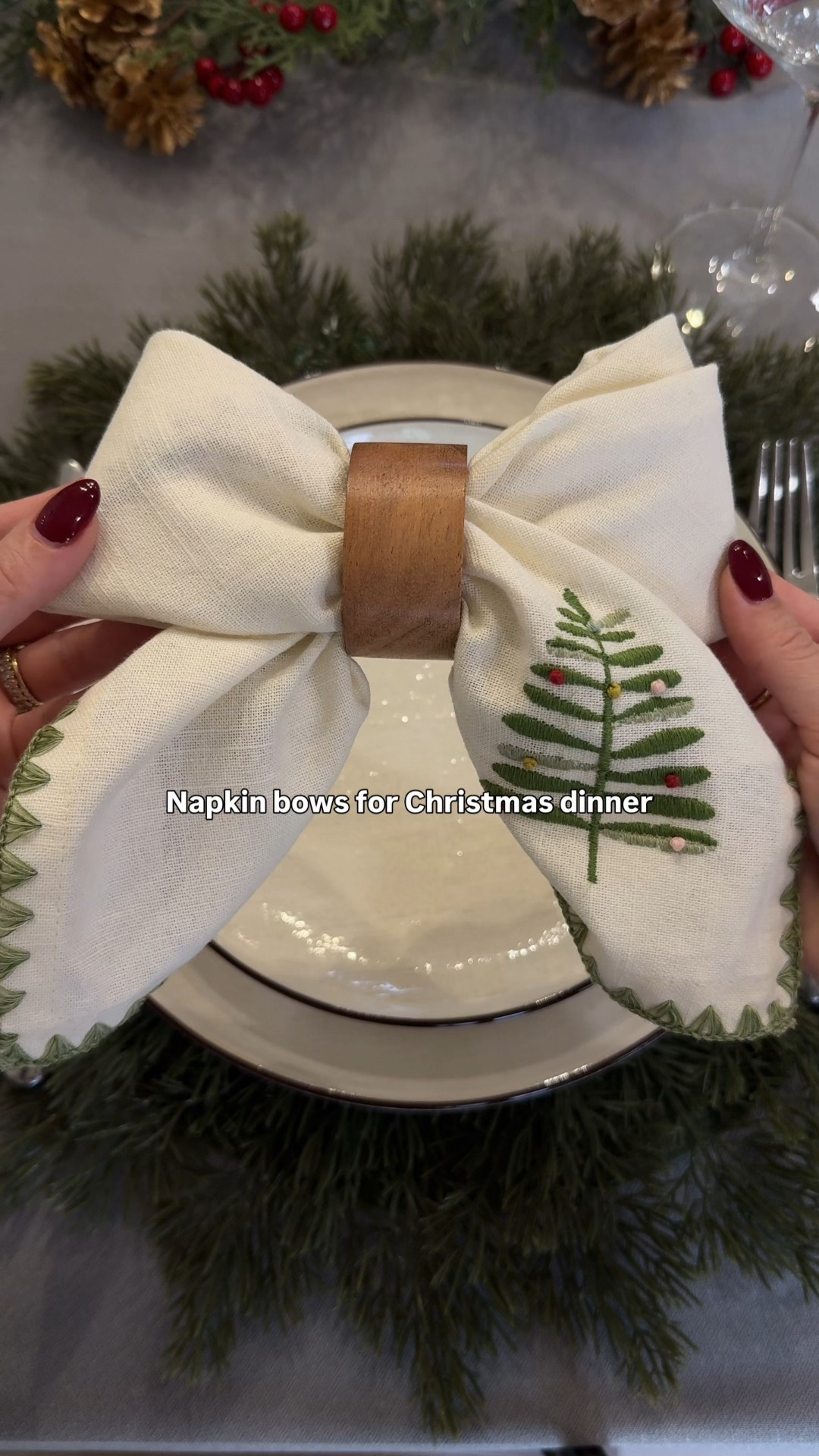 Here’s how I made these napkin bows for my Christmas table settings!🎄 Any cloth napkin will work!

I love the detail on these embroidered napkins - the green borders and Christmas tree detail is so perfect! 
•
•
Christmas table, Christmas table setting, Christmas table decor, Christmas dinner, holiday hosting, hosting tips, hosting Christmas, napkin bows, napkin fold, table setting, place setting, Christmas chargers, hostess tips 

#LTKHoliday #LTKSeasonal #LTKHome