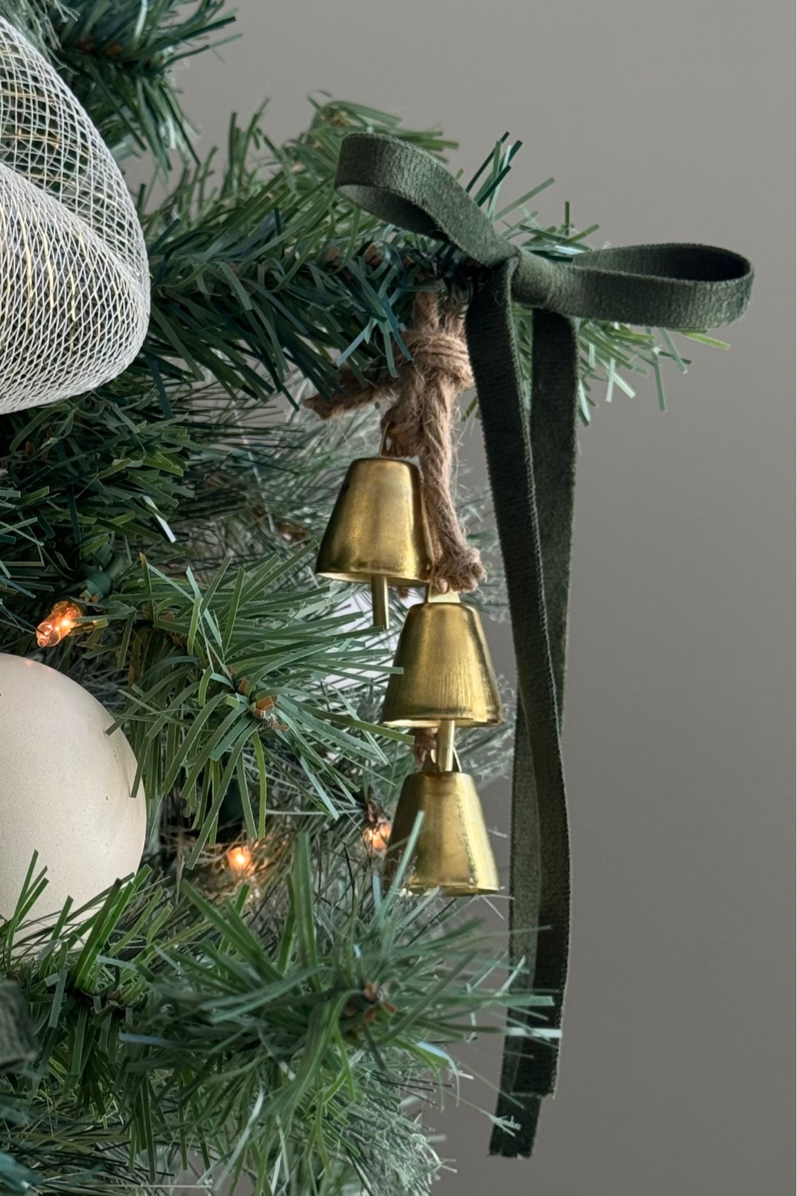 Deep green & gold moment ✨ I love how this velvet ribbon is the same material on both sides and there isn’t a “good” side of the ribbon! Makes tying and hang it on your tree so much easier!! 

I got these gold bells at Hobby Lobby! It is actually a bell garland that they had that I cut up and tied stagger like this. Unfortunately they are sold out online so I have linked some great options below!! Target has also exact dupes that are already tied together 👏🏼

#LTKStyleTip #LTKHoliday #LTKFindsUnder50