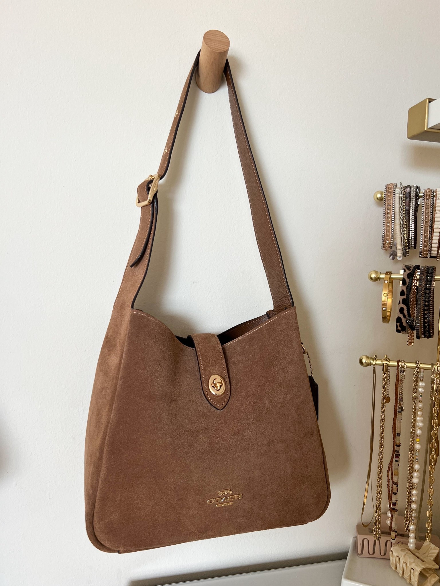 Love this suede Coach shoulder bag, currently 30% off! It’s the perfect size and I’ve been using it on repeat!

#LTKbag #LTKsale