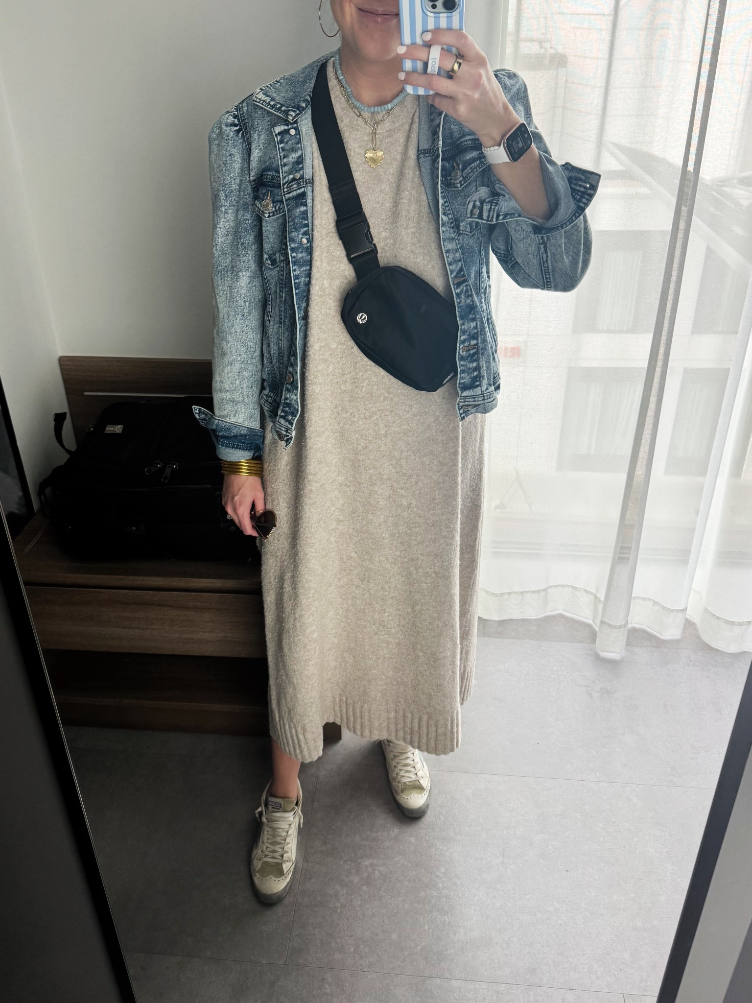 The perfect layover outfit for a spring day in London. My favorite comfy sweater dress and the best denim jacket with the cutest puff sleeves for layering which is currently on sale and under $40!

#LTKFindsUnder50 #LTKSaleAlert #LTKTravel