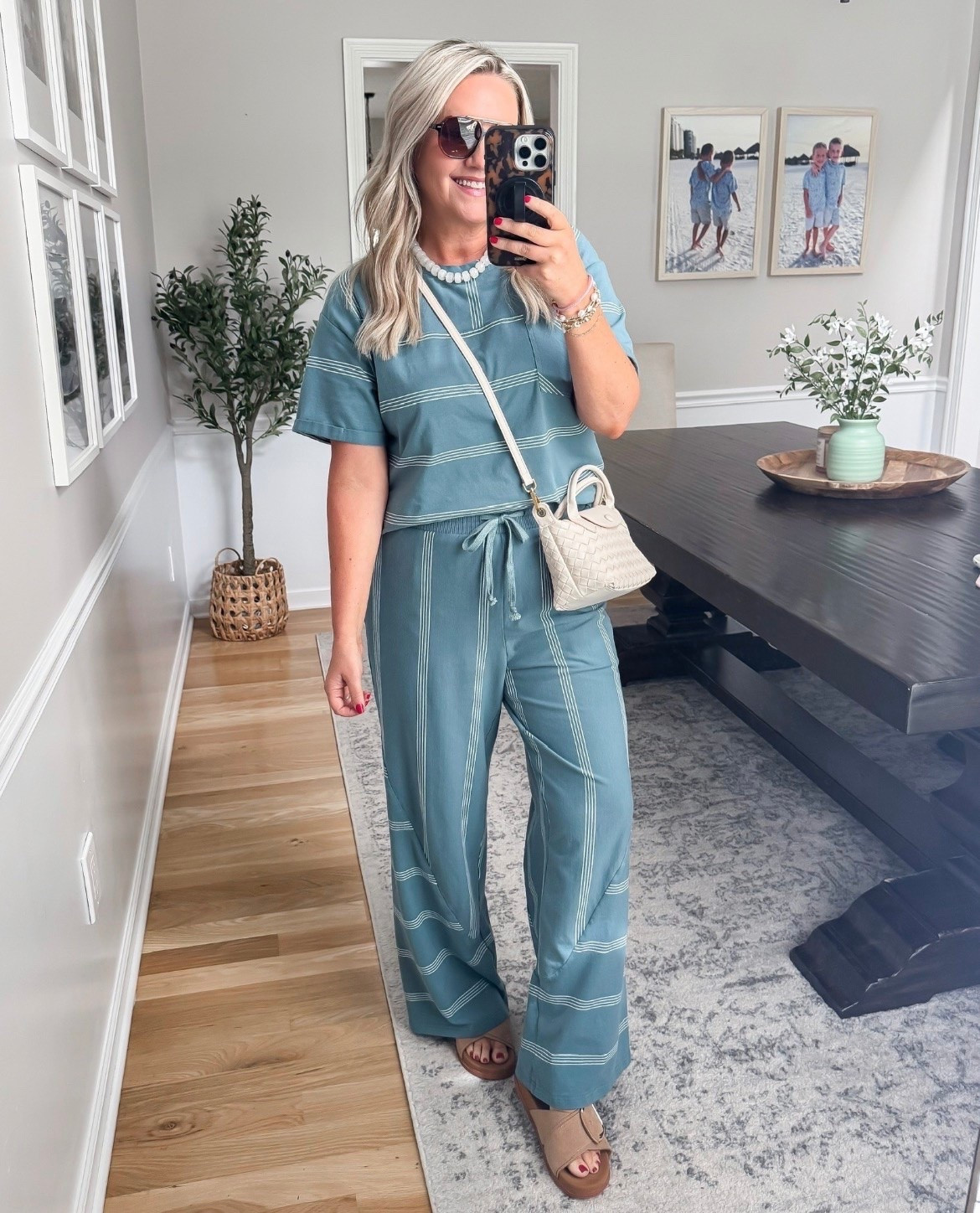 TRENDING! This matching set is one of those outfits that looks effortlessly put together while still feeling incredibly comfy. Love the soft blue color, relaxed fit, and subtle stripe detail, plus the little white bag makes it feel so elevated for vacation, brunch, or summer travel days.

matching lounge set, blue two piece set, vacation outfit, resort wear, comfy chic outfit, wide leg pants outfit, casual summer style, travel day outfit, elevated loungewear, beach vacation look, neutral accessories, summer fashion finds, lovelylifestyling

#LTKOver40 #LTKSeasonal #LTKootd