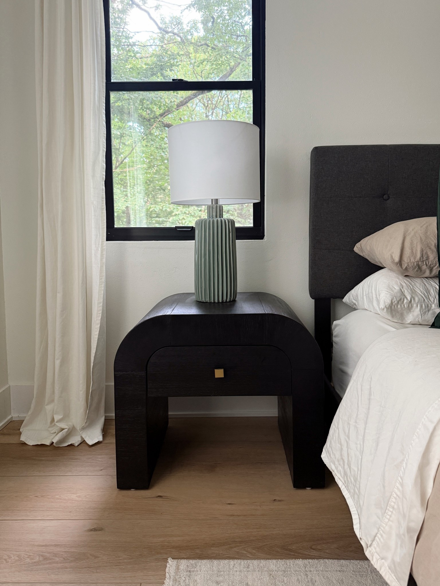 Subtle statements for our bedroom design with a black arched nightstand and green fluted ceramic table lamp 🖤💡

Amazon duvet and vintage rug also linked! 

#LTKHome #LTKSaleAlert