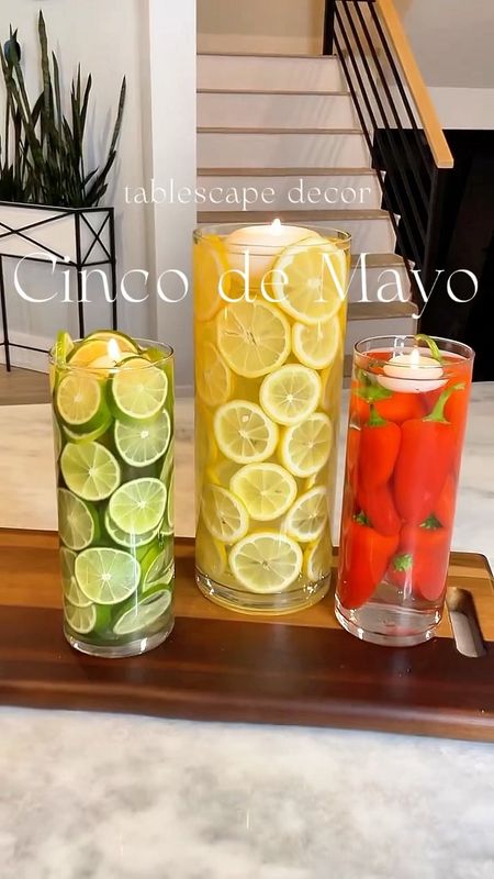 Cinco de Mayo Tablescape- Perfect for Spring 

This is such a fun, simple and inexpensive centerpiece. Last year I had this up for a #cincodemayo party and everyone adored this decor trio. The one trick you need to be made aware of is that you have to use whole limes or lemons in the center of a cylinder vase that does not have a second vase inside of it.  This will help so that the sliced lemons or limes stay against the wall of the vase. And the lemons and limes will keep the consistency of the color in each vase. Then add your water and a floating candle to the top. It's a simple as that! Enjoy!

Cinco de Mayo | Cinco de Mayo Party | Homedecor | Easy Home Design | Modern Design | Party Decor | Lemons | Limes 

#LTKfindsunder50 #LTKparties #LTKhome