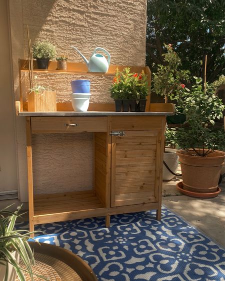 Garden. Patio. Backyard ideas. Potting bench. Potting station. Garden storage. Patio rug. Patio decor. 

#LTKFind #LTKSeasonal #LTKhome