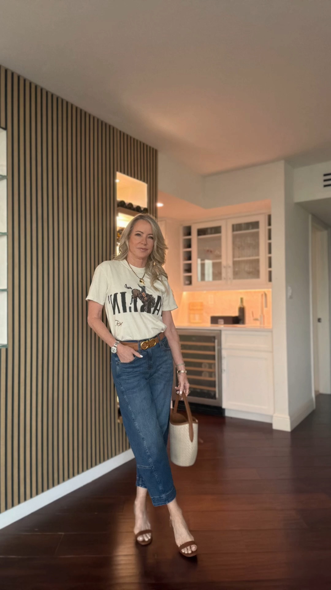 An easy everyday outfit with a vintage-inspired graphic tee, relaxed denim, woven bucket bag, and heeled sandals. Classic pieces you’ll wear on repeat.

#LTKootd #LTKOver40 #LTKSeasonal