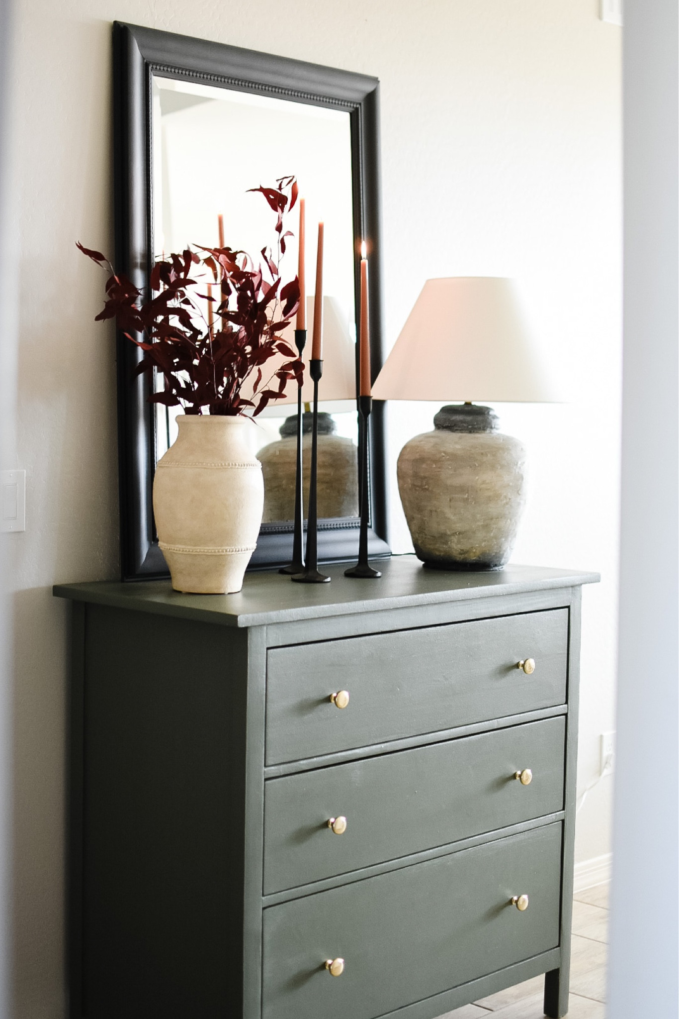 I’m in love with these black taper candle holders from Amazon and copper brown taper candles from Pottery Barn! Just a few simple touches to make it feel like fall. Also, did you notice we switched out the knobs for these polished brass ones? Such an easy and affordable upgrade!

#LTKhome #LTKstyletip #LTKSeasonal