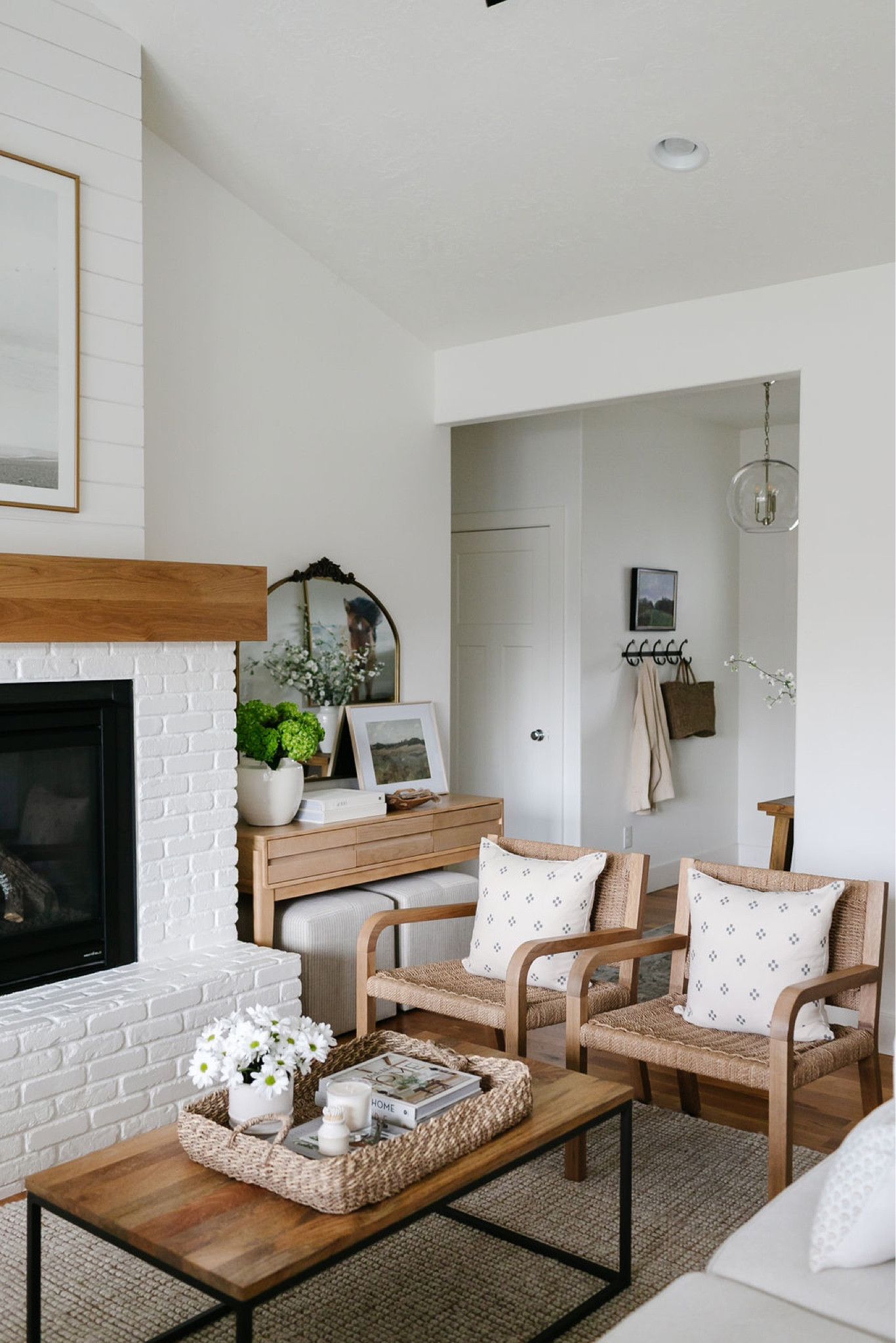 In our living room we have a West Elm coffee table with mango wood top, a Pottery Barn wool jute area rug and woven and wood chairs. 

#LTKsalealert #LTKhome #LTKFind