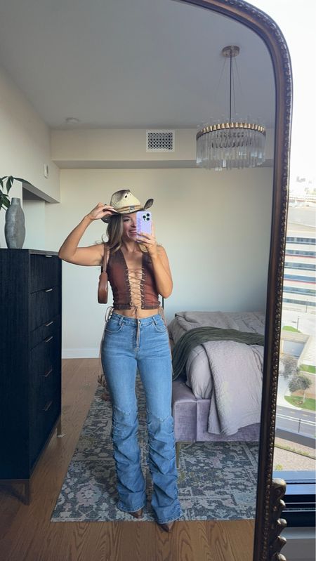 Western concert outfit. Denim and leather look cma fest outfit in my usual small/2
Loving tan code: emerson 

#LTKStyleTip #LTKParties #LTKSeasonal