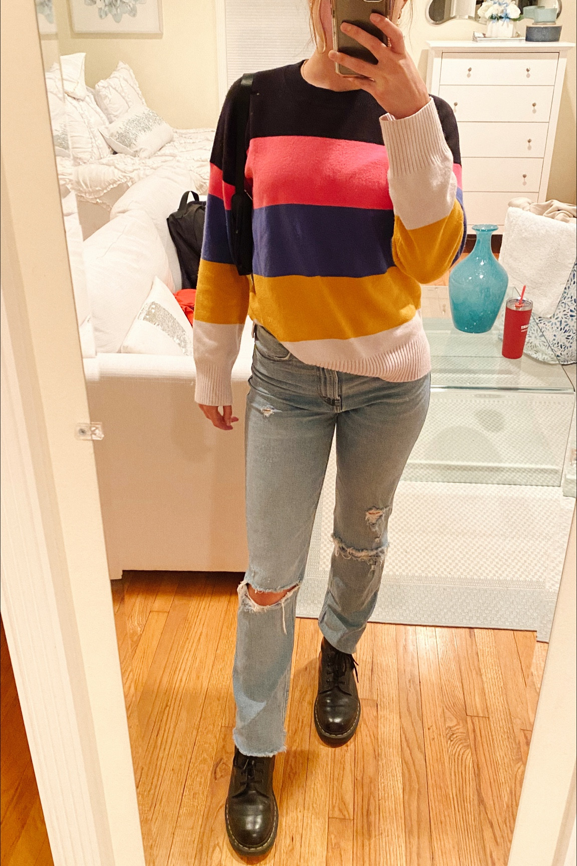 Striped sweater and jeans, a perfect casual outfit. I’m wearing docs to go along with the look and a mini black purse. 

#LTKfit #LTKstyletip #LTKSeasonal