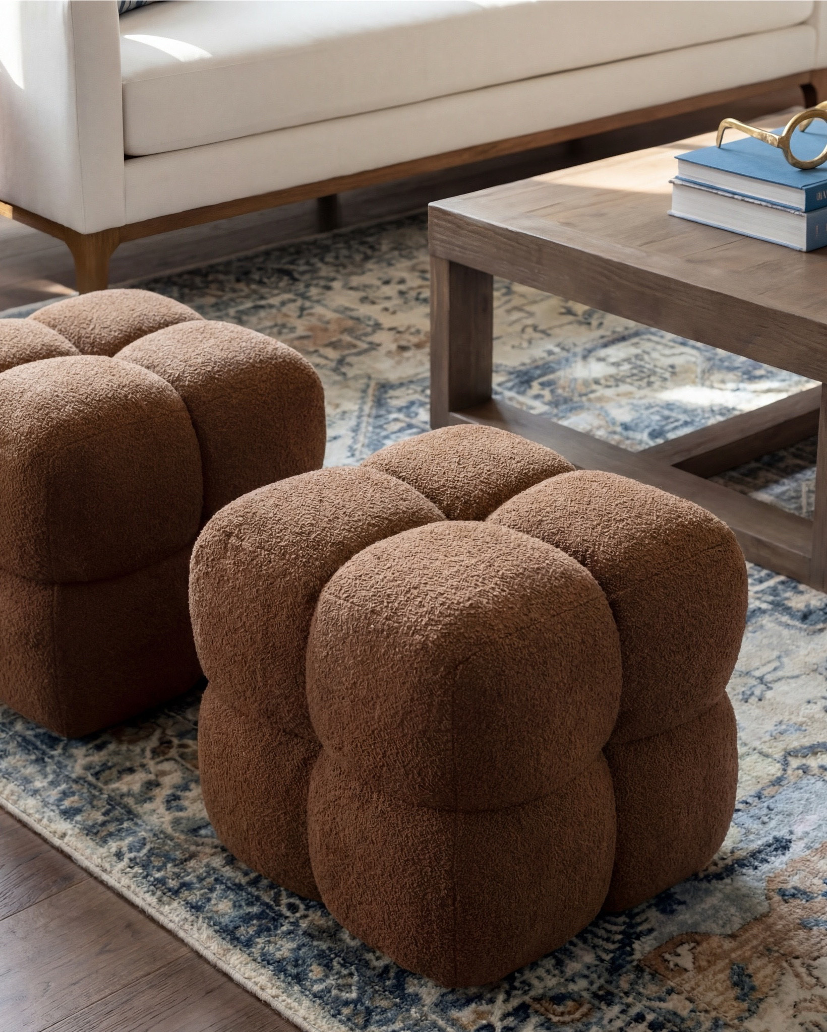 Shop the Look:
• Cream upholstered sofa (clean modern lines)
• Wood frame accent chairs with light neutral cushions
• Warm brown boucle cube ottomans
• Medium wood square coffee table
• Blue and beige vintage-style area rug
• Marble fireplace surround (white with soft veining)
• Dark wood ceiling beams
• Round wood fluted side tables
• Small ceramic table lamps (warm neutral base)
• Blue ceramic decorative vase
• Neutral textured throw blanket (warm brown)
• Blue linen accent pillows
• Floating wood wall shelves
• Wood storage cabinet with brass bird knobs
• Abstract neutral wall art (warm brown tones)
• White globe pendant light

#LTKhome #LTKsale #LTKstyletip