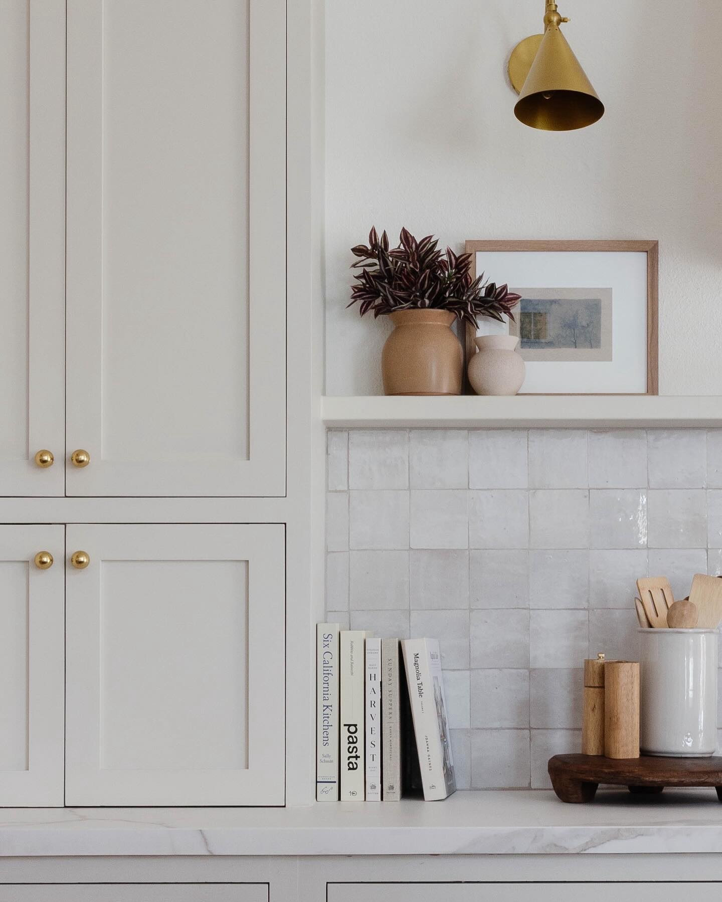 Take 15% off all full-price Scout & Nimble items with code PEGGYH15. Did you catch the reveal from earlier this week? 🏡✨ We're back with more from Project Meadowbrook, showcasing our stunning off-white kitchen transformation! 🤍✨ Soft white cabinets and backsplash, accented with hints of brass and natural wood tones, create a kitchen that's both stylish and inviting.
 
We added a floating shelf on the range wall, styled with functional breadboards, decorative vases, scalloped iron candle sticks, and art. The gorgeous décor on the shelf and countertops do just the trick to beautifully tie everything together.
 
#KitchenReveal #InteriorDesign #ModernFarmhouse #CaliforniaCasual #KitchenInspo #HomeTransformation #PeggyHaddadInteriors
#KitchenInspo #ParisianStyle #CaliforniaCasual #HomeDesign #PeggyHaddadInteriors 

#LTKFindsUnder100 #LTKHome