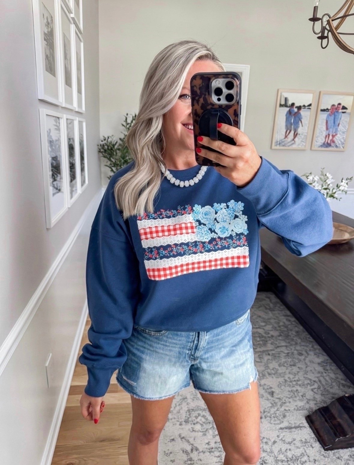 Bestseller! This patriotic sweatshirt is giving cozy with a cute twist. I love the floral flag detail paired with classic denim shorts for an easy outfit that works for Memorial Day, Fourth of July, and all of your summer plans.

patriotic outfit, Memorial Day outfit, Fourth of July outfit, summer sweatshirt, denim shorts outfit, casual summer style, Americana outfit, mom style, everyday fashion, cute graphic sweatshirt, lovelylifestyling

#LTKSeasonal #LTKootd #LTKTravel