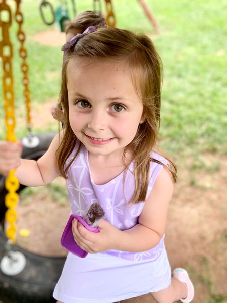 My Purple Popsicle eater perched on a tire swing eating a Purple Popsicle. Now, say that 5 times.

#LTKSeasonal #LTKkids #LTKFind