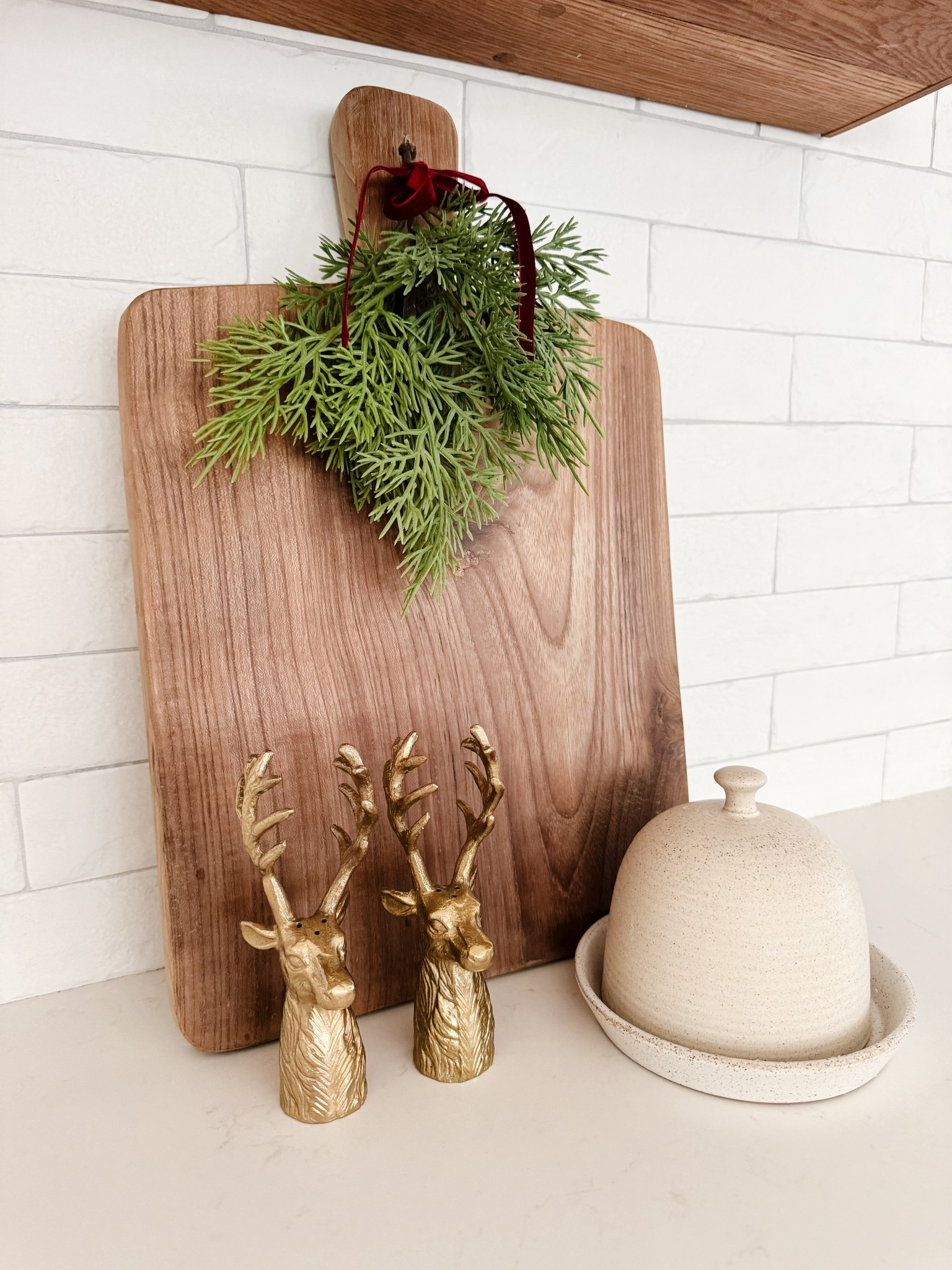 Simple holiday kitchen decor 
Holiday bread or charcuterie board
Brass accents/ deer salt and pepper shakers/ butter dish/ kitchen decor 

#LTKHome #LTKHoliday #LTKSeasonal