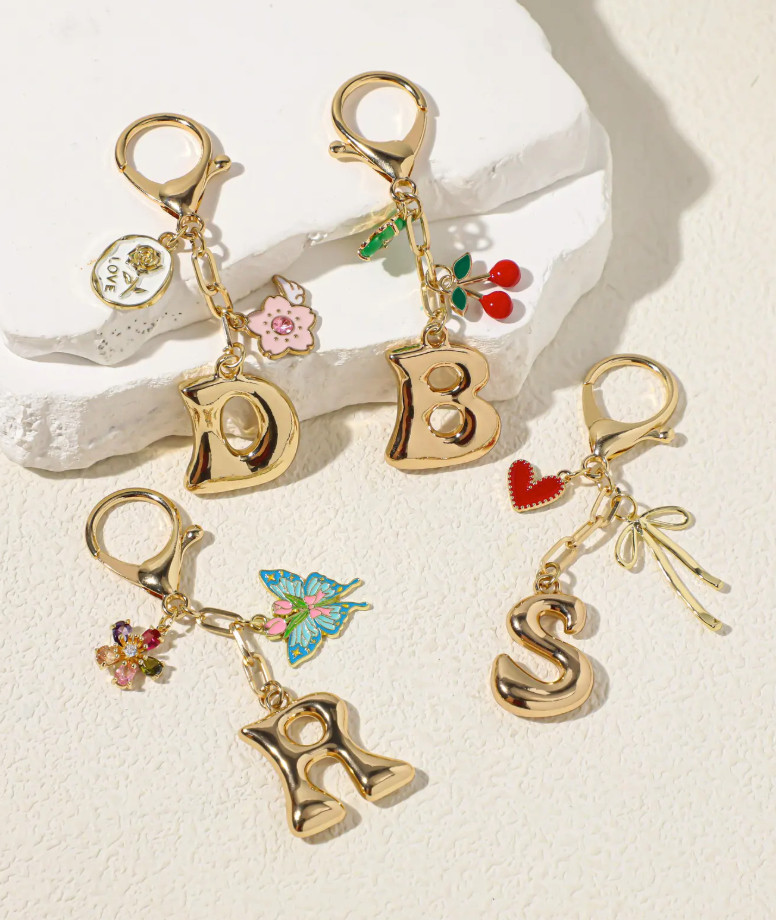 Bag charms are having a moment ✨ and I love how these gold initial charms instantly elevate even the simplest bag. Fun, personal, and the perfect finishing touch for your everyday carry. Linking a few other bag charm styles I’m loving 💛

#bagaccessories #styleadditions #initialnecklace #fashiondetails #ltkfinds #trendingaccessories 

 #LTKFindsUnder50 #LTKFindsUnder100