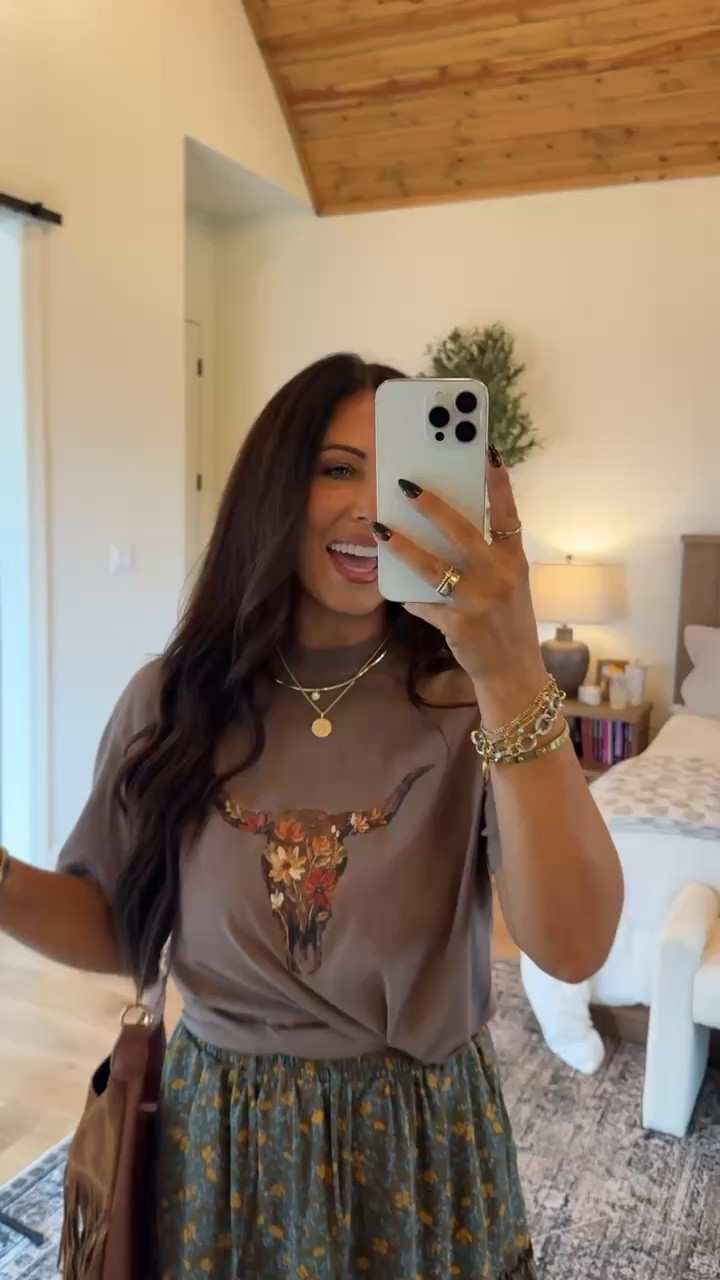 Western meets feminine in this adorable outfit! I paired a floral longhorn graphic tee with a tiered floral maxi skirt, cowboy boots and a fringe bag for the cutest boho Western look.
#WesternStyle #GraphicTee #MaxiSkirt #CowgirlOutfit