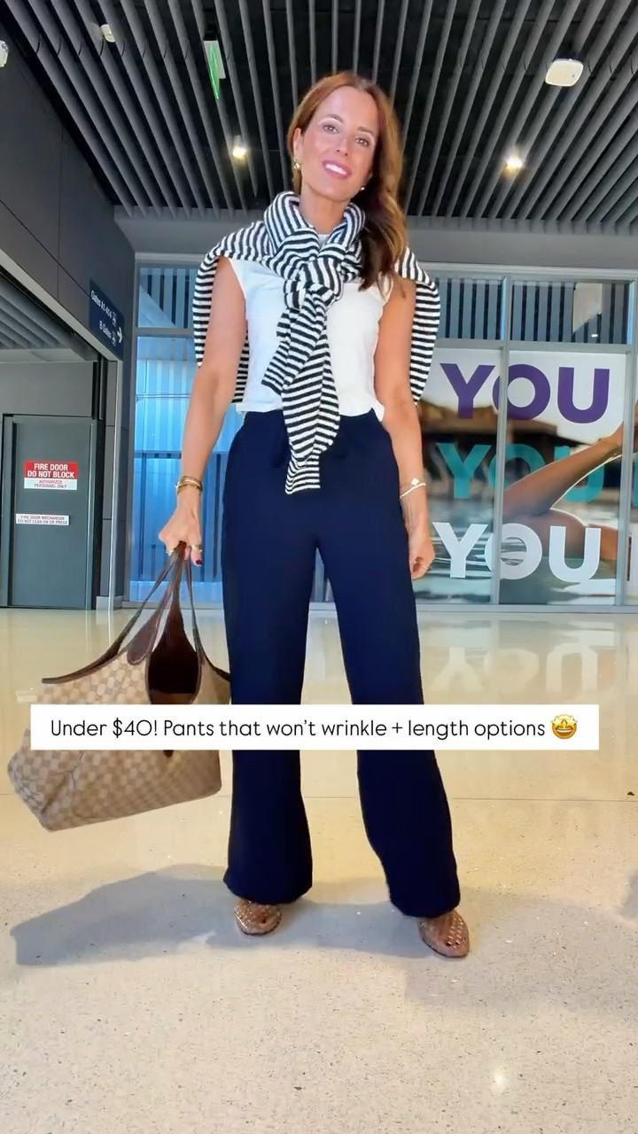 Amazon pants that won’t wrinkle in XS petite, color ‘admiral’. My travel outfit of the day! White t-shirt in XS. Striped navy sweater in small. Airport outfit. Casual outfit. Everyday outfit. Fall outfit. Teacher outfit. Business casual pants. Workwear pants.