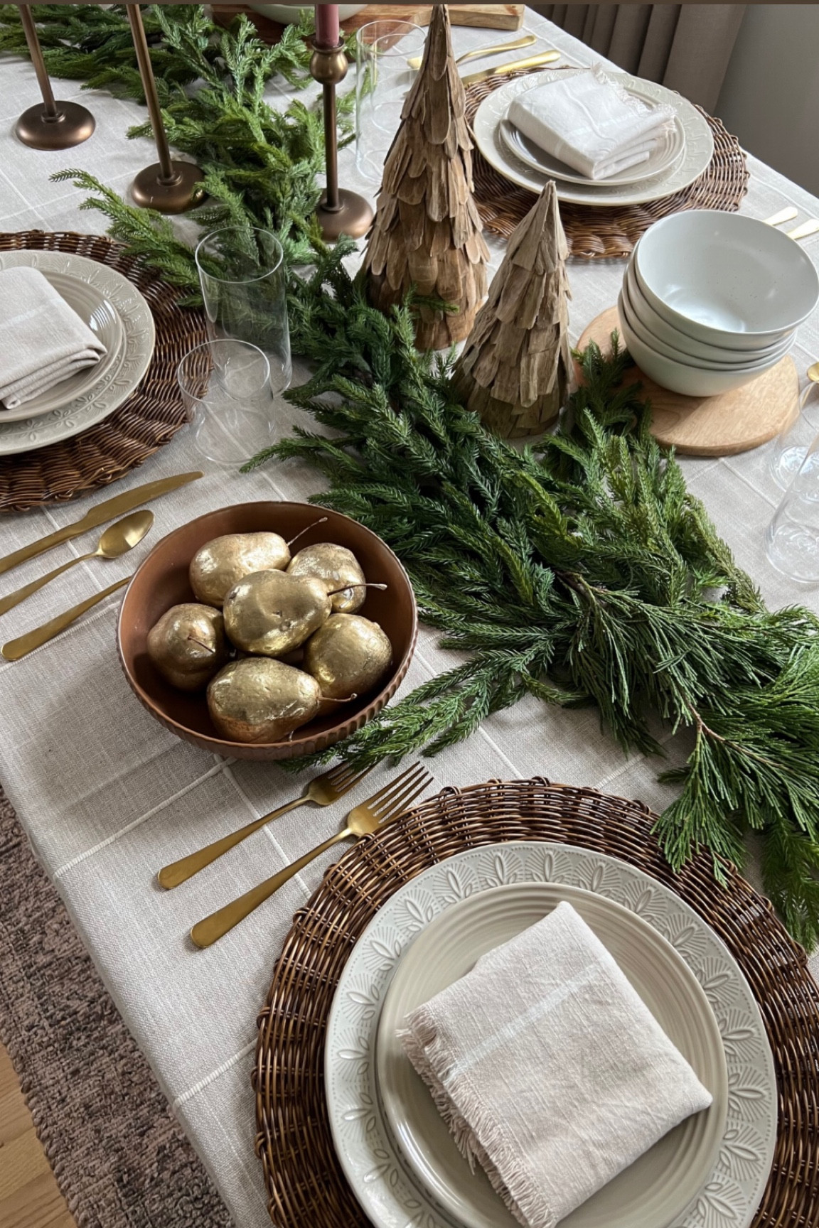 Holiday neutral tabletop decor with green garland 

#LTKhome #LTKHoliday #LTKSeasonal