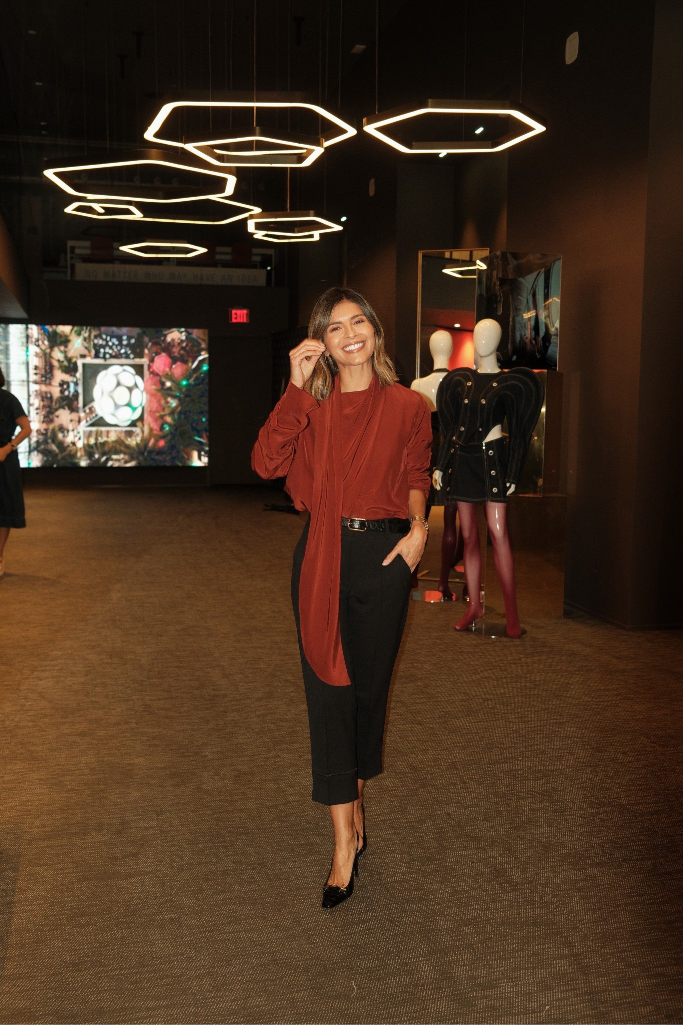 Red top and black cropped trousers 