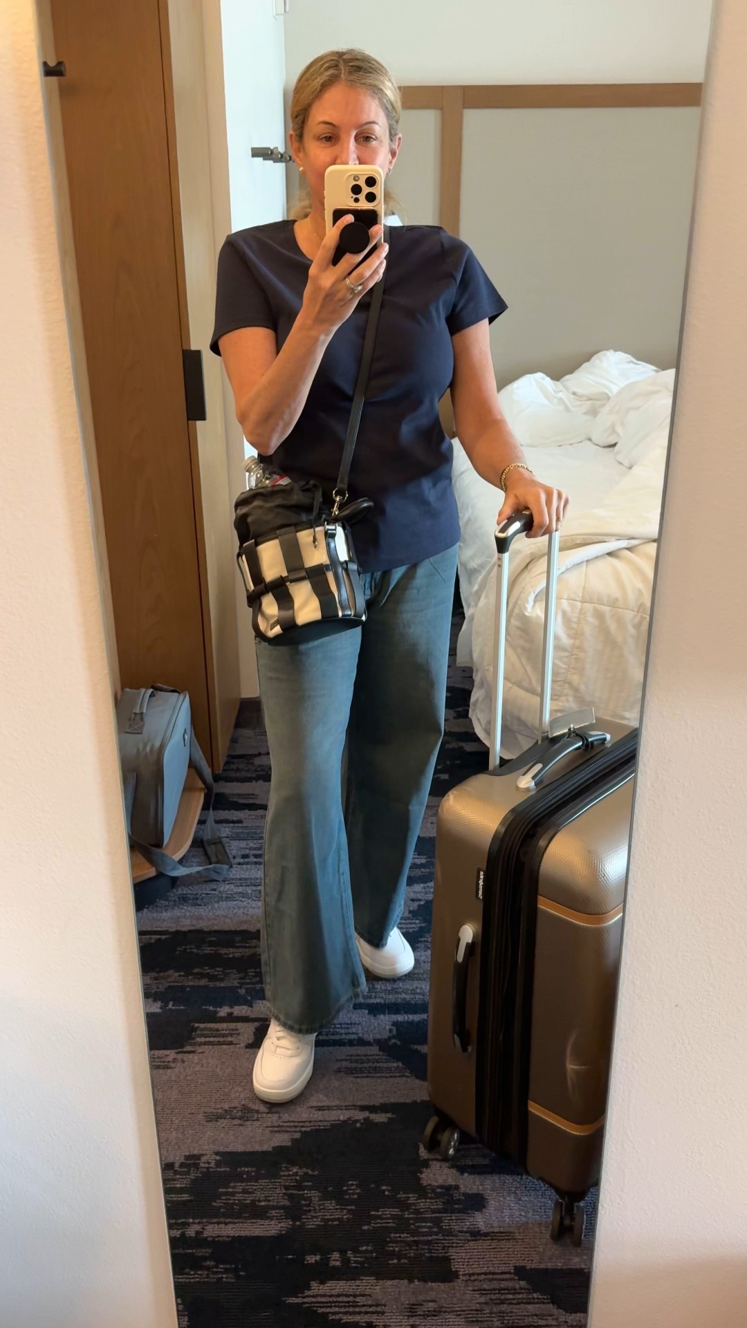 Travel Day. Wide leg jeans and tshirt paired with sneakers.

#LTKOver40 #LTKTravel #LTKMidsize