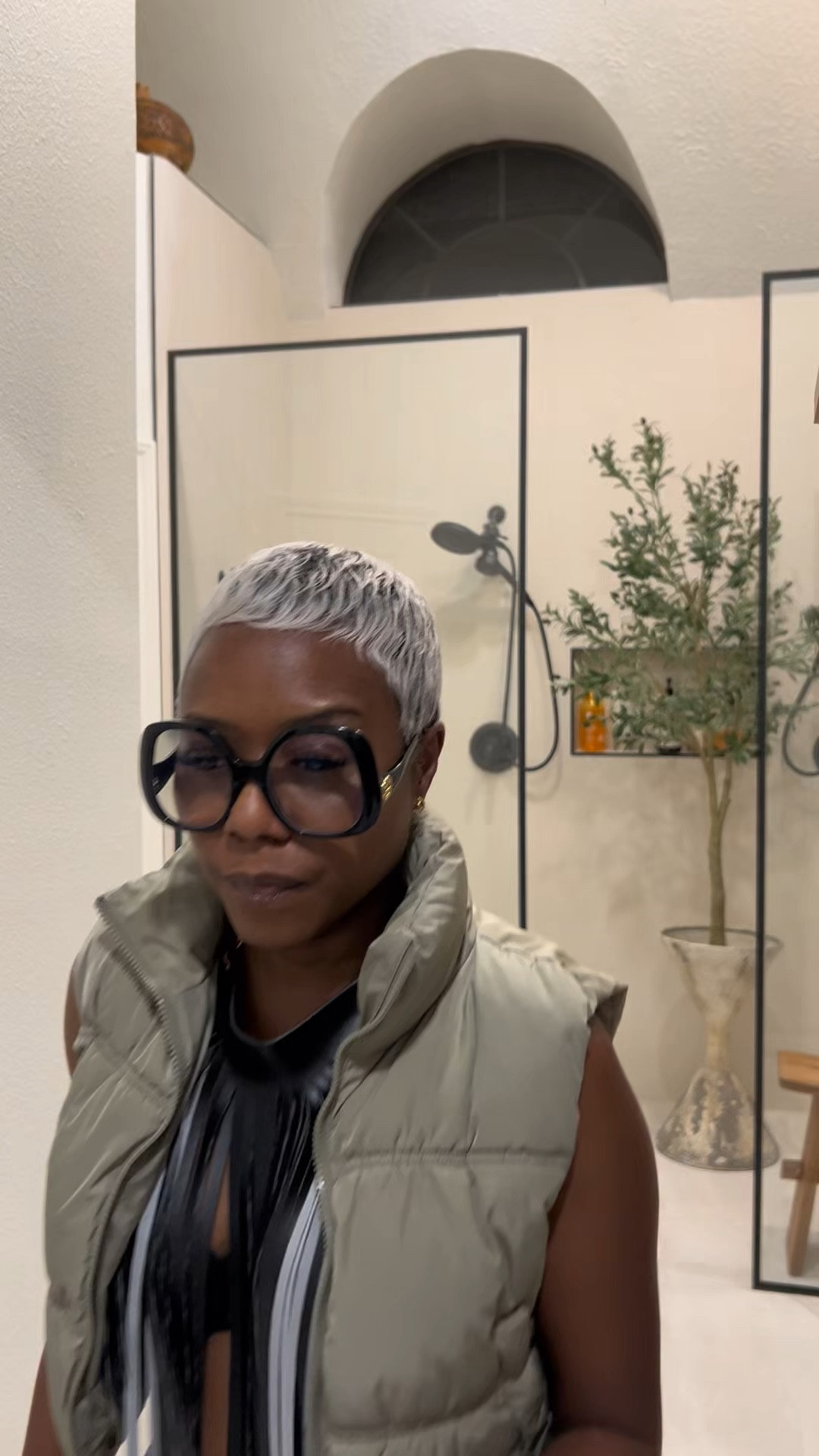 Puffer vest and leather necklace 