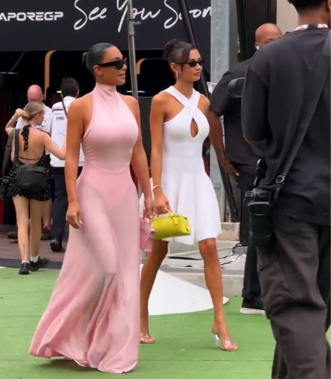 @kimkardashian attended the Singapore Grand Prix with friend @kristennowelcrowley, wearing a $3,290 @maisonalaia Turtleneck Maxi Dress in pink. Hot! Or Hmm..?

🎥 @f1nightrace

#kimkardashian #kimkardashianfbd #kimkardashianstyle #alaia
