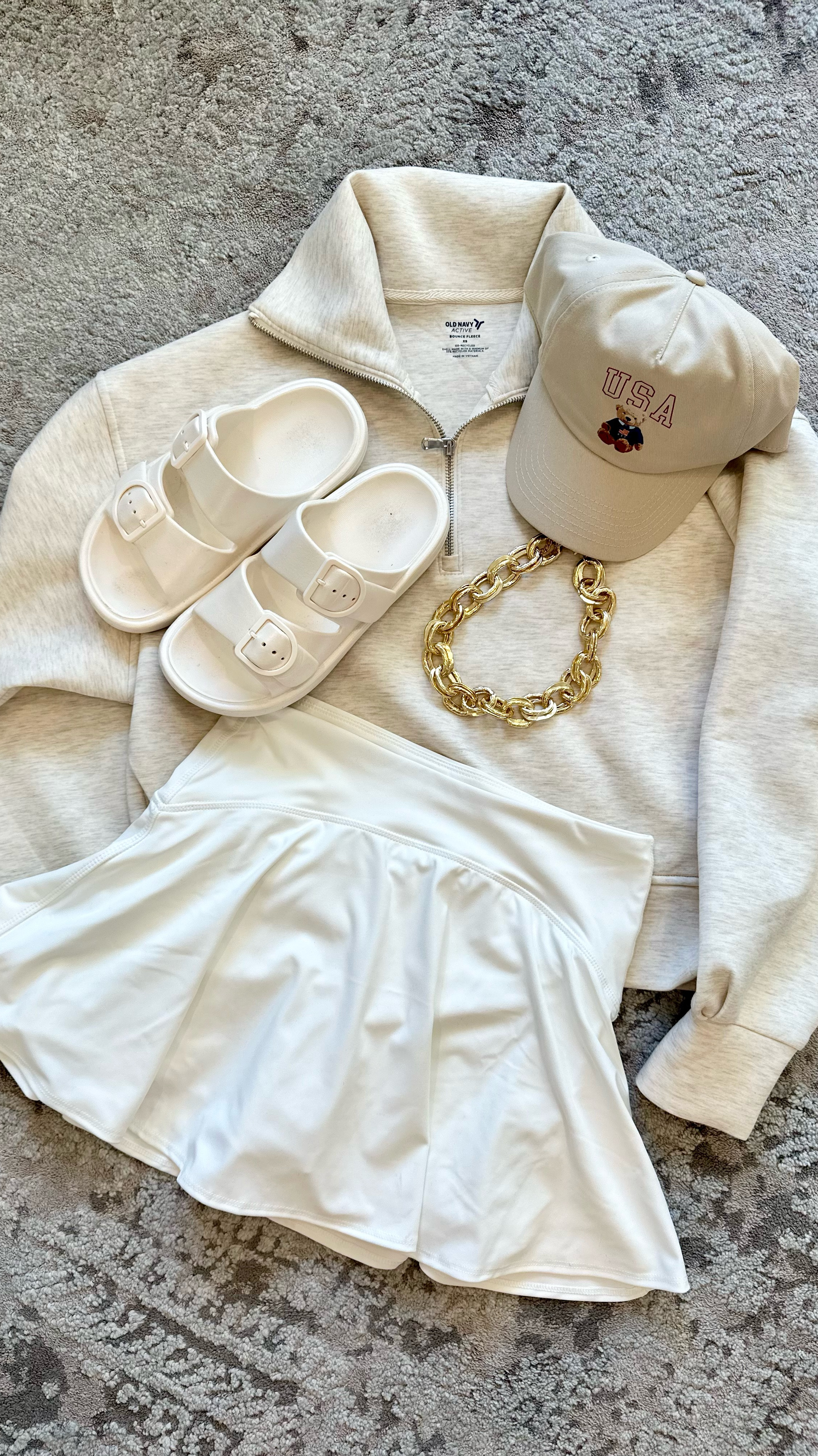 Want a less traditional MDW outfit? You don’t have to do red, white, and blue! I love this monochromatic look with a touch of patriotic! 🐻 🇺🇸 This adorable USA baseball cap will get so much use…Memorial Day, 4th of July, swimming pool, beach day, Labor Day. Allllll the things! 🤍🤍🤍🤍 
I’m 5’2” 108 lbs. 
skirt: small 
sweatshirt: XS
sandals: girls’ 2-3

#LTKSummerEdit #LTKSwim #LTKStyleTip