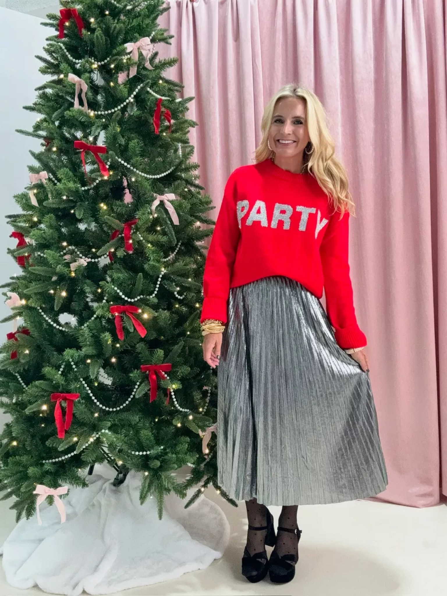 Obsessed with this sweater and skirt combo from Avara's holiday collection! The pop of red and metallic pleated skirt? Pure perfection. Wearing a size XS and it's fab! Save 15% with code FANCY15. Perfect for the holiday season!

#LTKHoliday #LTKSeasonal #LTKStyleTip