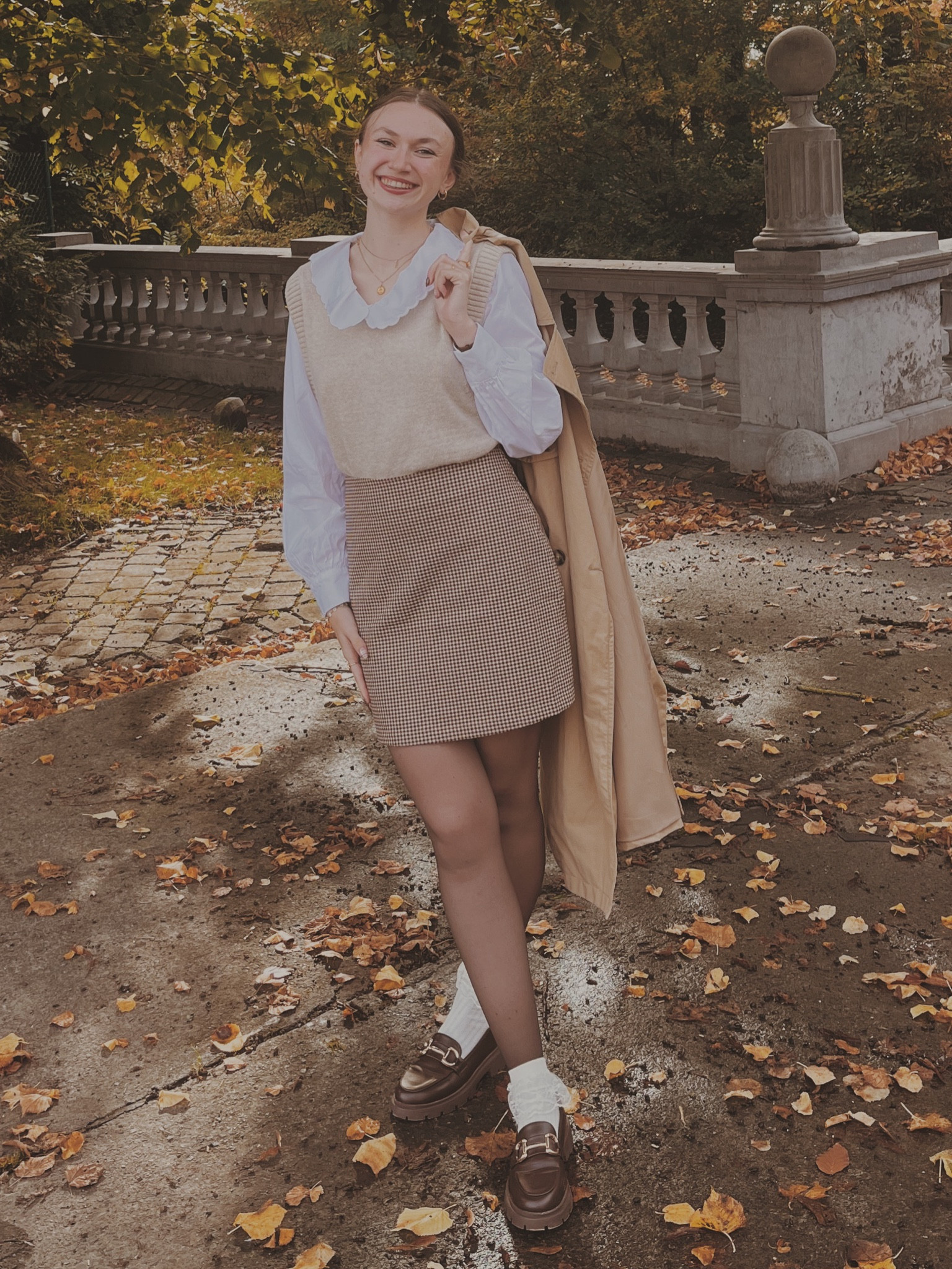 Shirt with Peter Pan collar 
Beige sweater vest
Checkered a line sweater 
Trench coat 

#LTKHoliday #LTKSeasonal