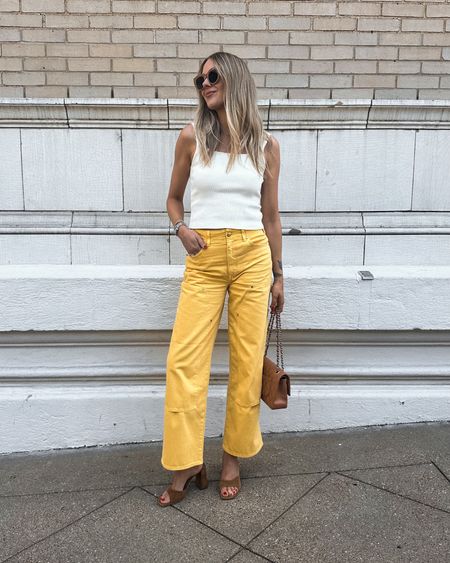 Fashion Jackson wearing ivory sweater tank (tts) yellow jeans (tts / I sized up for a relaxed fit) tan suede sandals #fashionjackson #shopbop #summeroutfits #nashvilleoutfits 

#LTKFindsUnder100 #LTKOver40 #LTKStyleTip