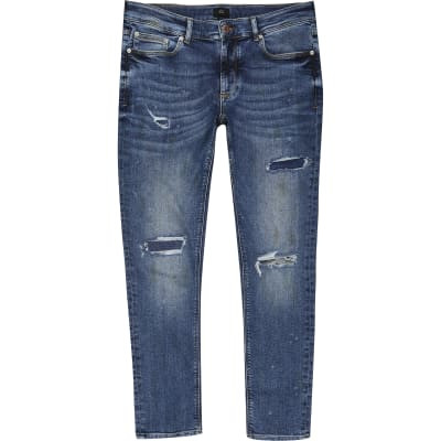 Mid blue ripped Sid skinny jeans | River Island (US)