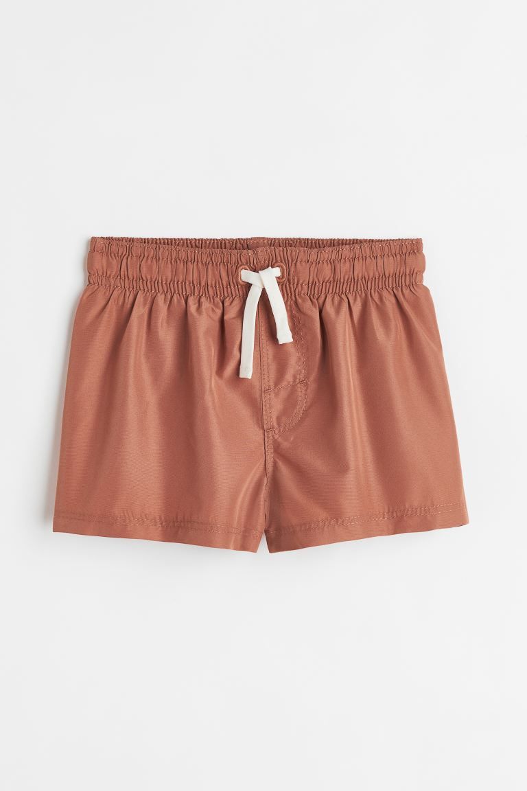 Conscious choice  Swim shorts with an elasticized waistband with drawstring and mock fly. Soft, m... | H&M (US + CA)