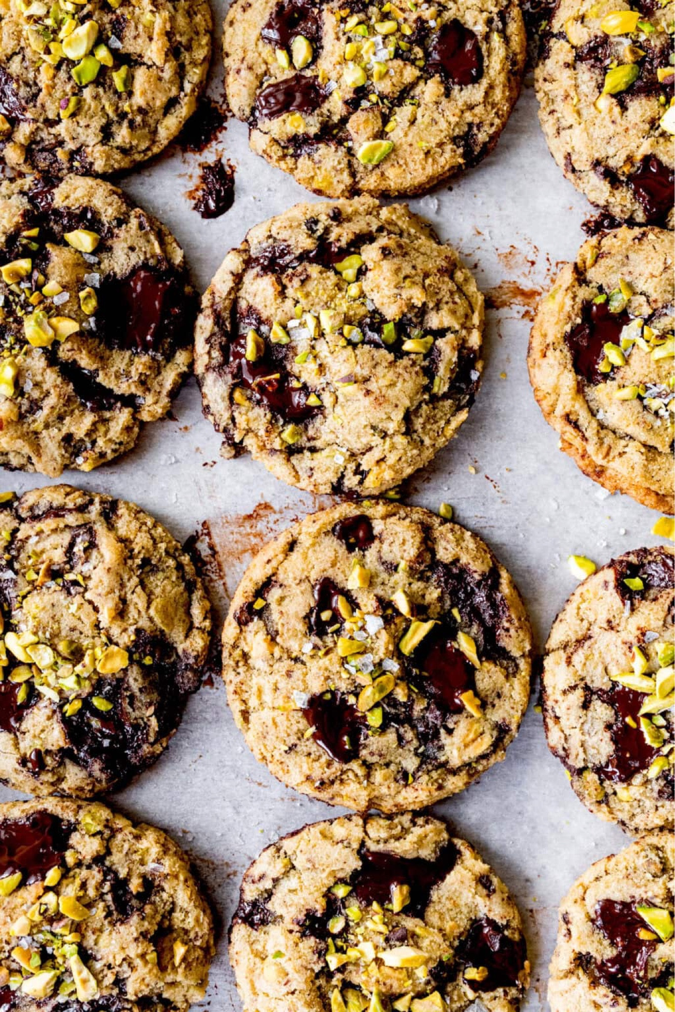 Dark Chocolate Chunk Pistachio Cookies-soft and chewy cookies with puddles of dark chocolate, crunchy pistachios, and a sprinkle of flaky sea salt. These unique, elegant cookies are SO delicious!

#LTKSeasonal #LTKHome #LTKFindsUnder50