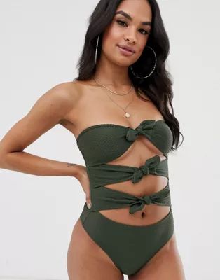 Missguided crinkle bandeau bow front swimsuit in khaki | ASOS US