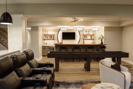 A beautiful basement entertaining area with a stunning bar , game area with a shuffleboard table and home theater seating. #modernbasement #basementideas

#LTKhome