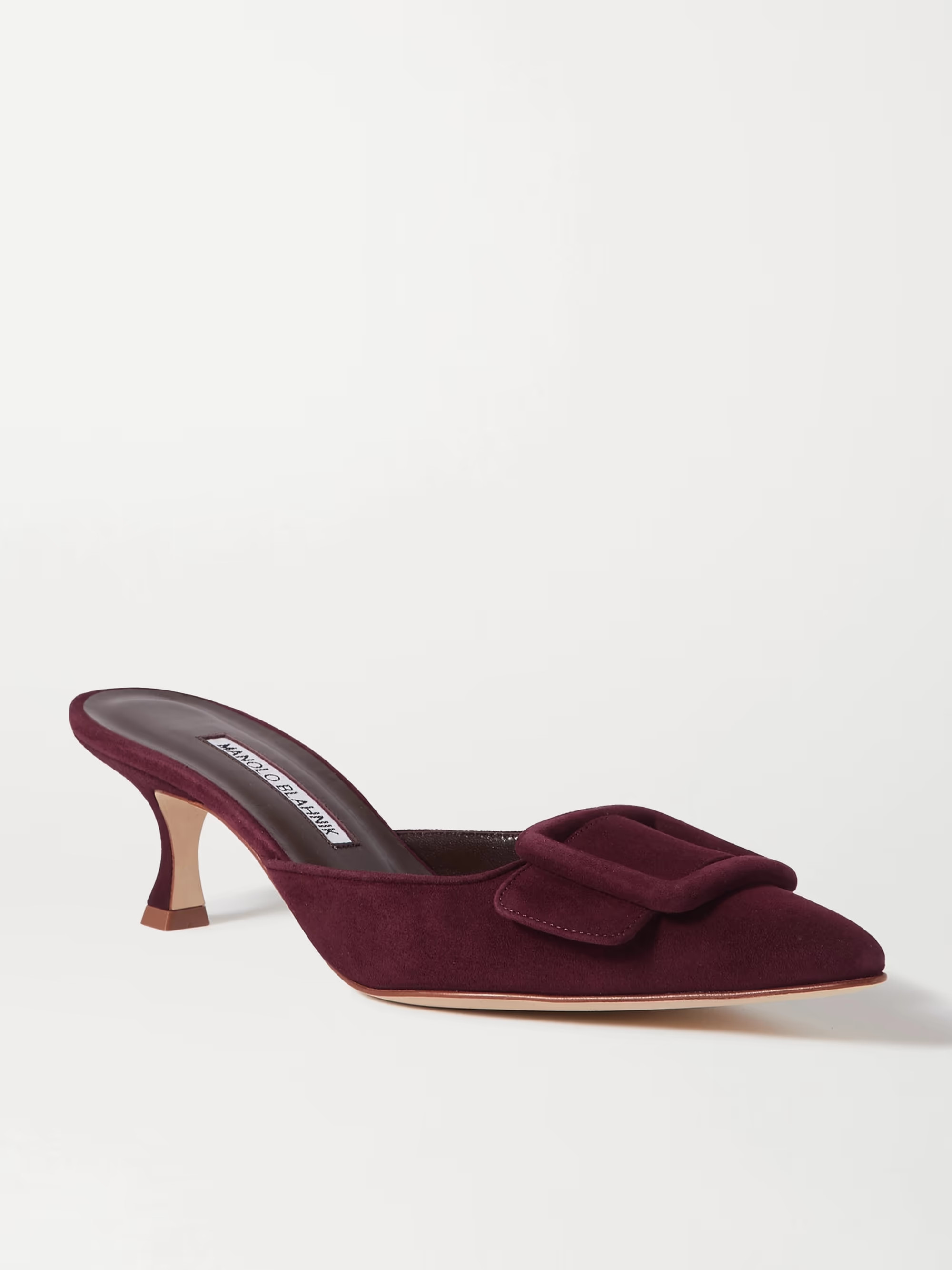 Manolo Blahnik debuted his iconic 'Maysale' mules in Isaac Mizrahi's Spring '91 runway collection... | NET-A-PORTER (US)