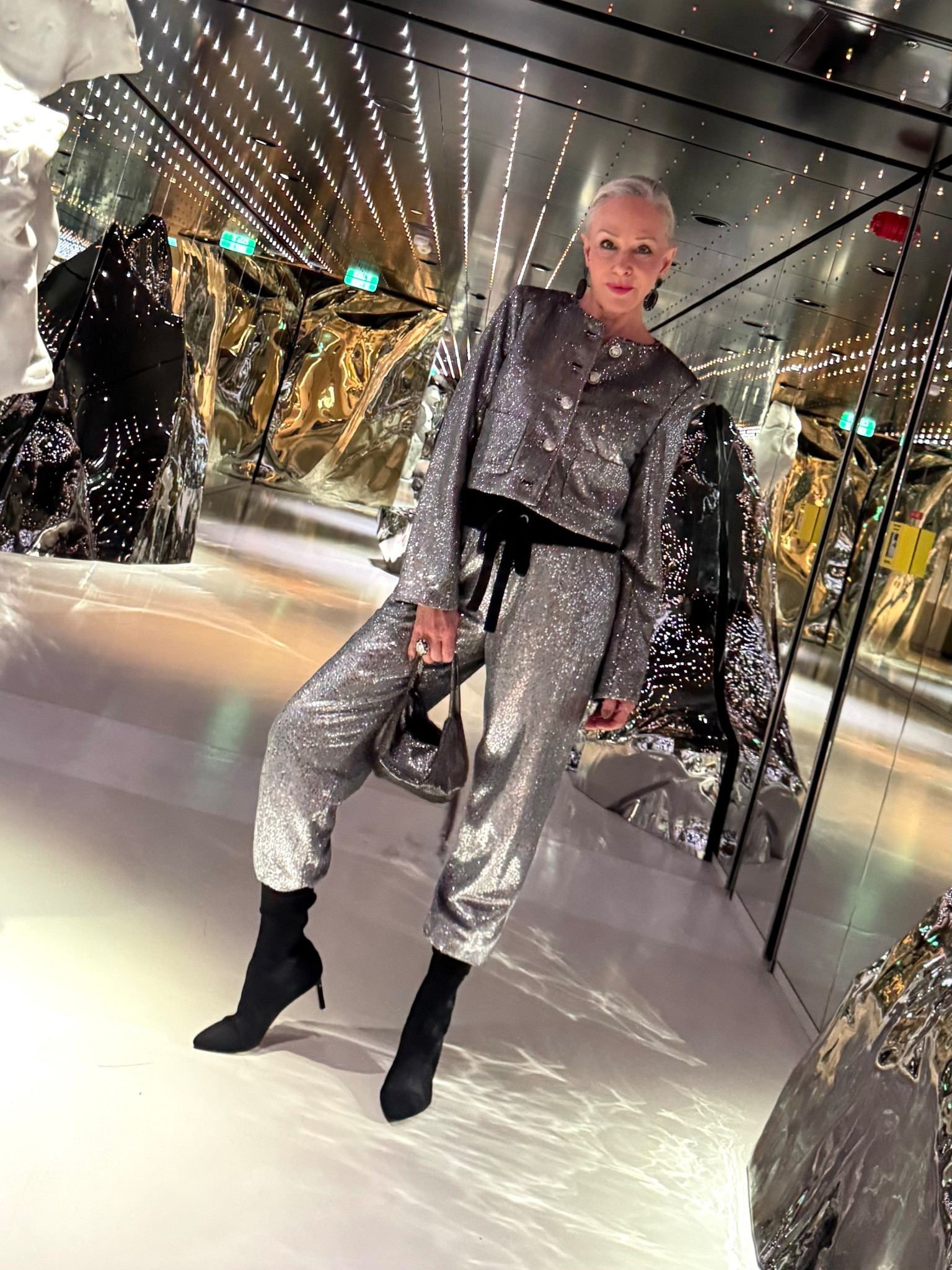 Randi silver sequin crop jacket and jogger pants.
Veronica Beard black Sox booties
Black camisole#LTKParties

#LTKOver40 #LTKSaleAlert