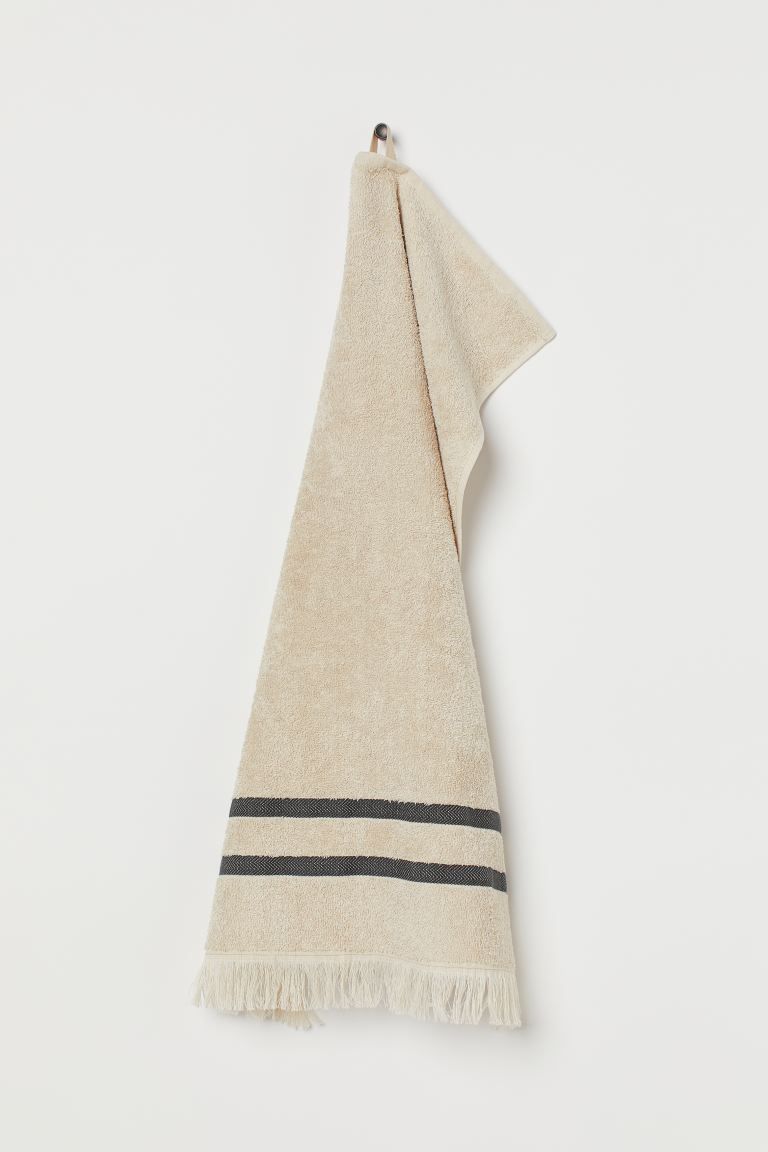 Hand towel in linen and cotton-blend terry. Fringe at one short side and hanger loop at other sho... | H&M (US + CA)